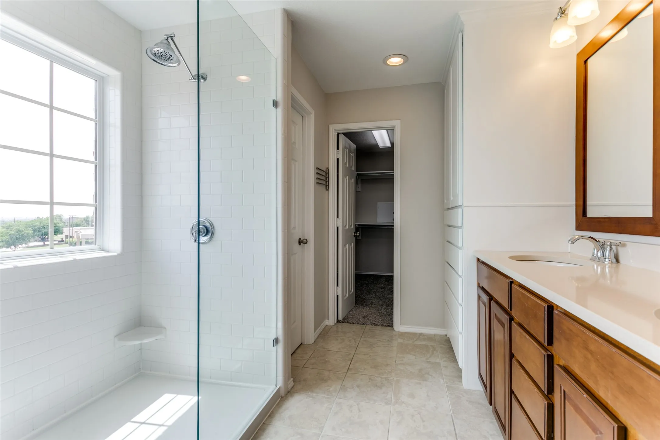 Full bath with a walk in closet