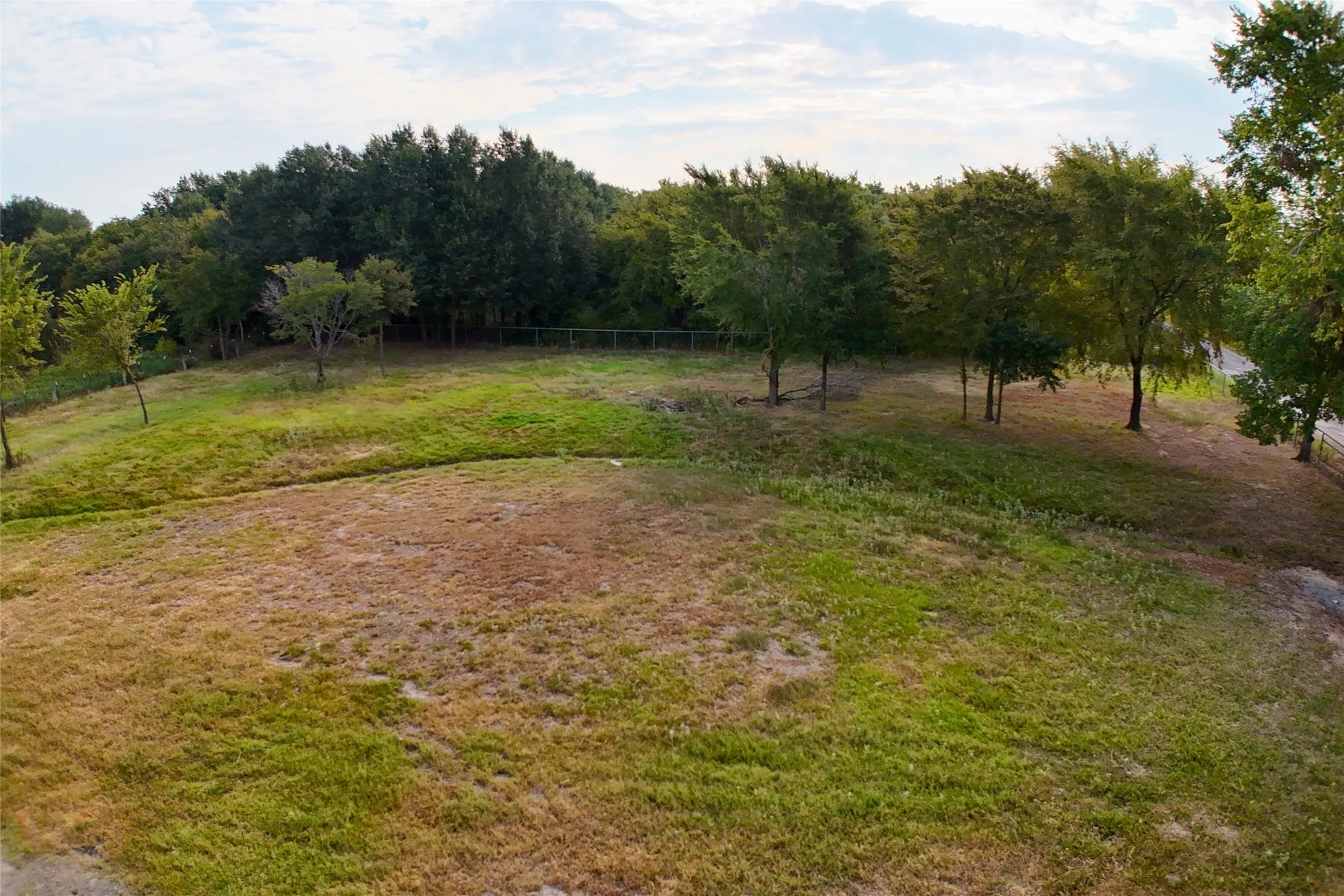 View of yard featuring fence