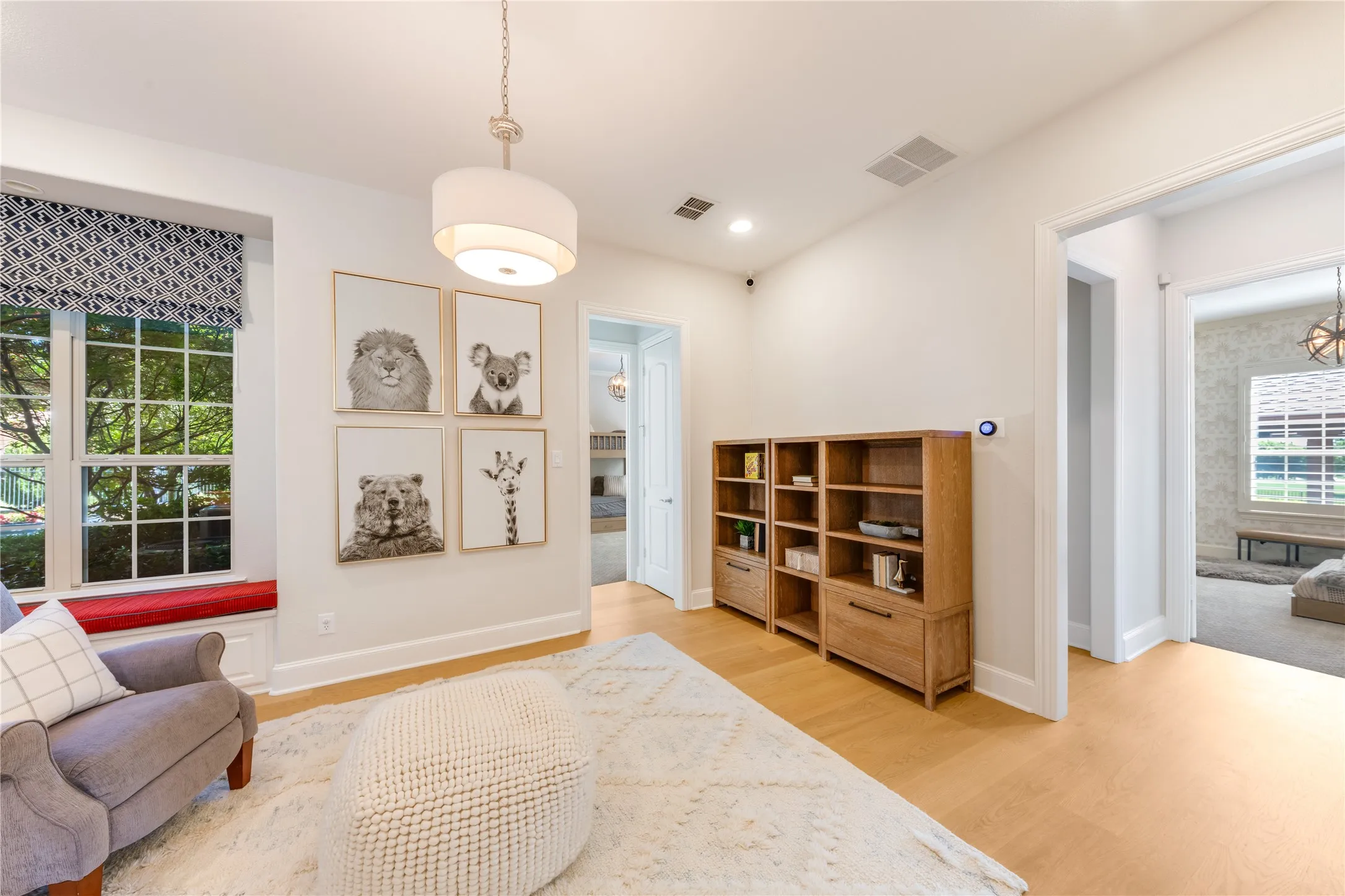 A retreat room between two more split downstairs bedrooms makes an ideal spot for a children's playroom or homework center. Tucked around the right corner is one of three powder baths..this one is convenient to the swimming pool as well.