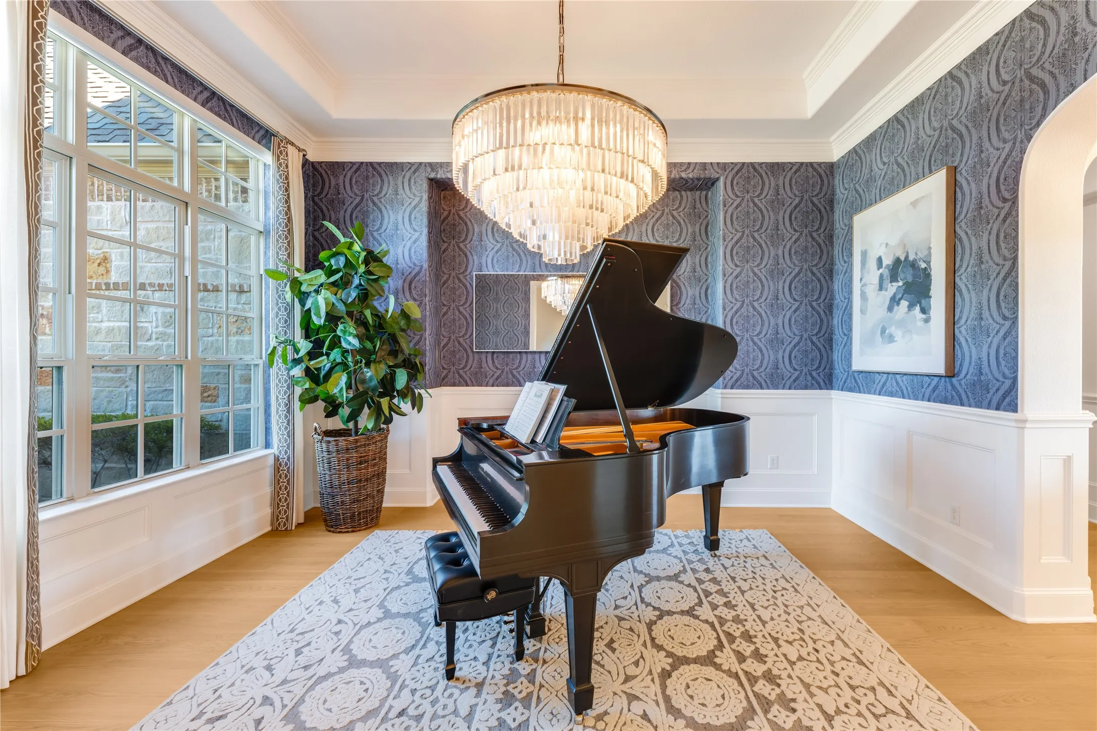 Designed to perfection for an inviting & elegant lifestyle, the formal dining room's impressive wainscoting, moldings & chandelier set the tone for refined entertaining.