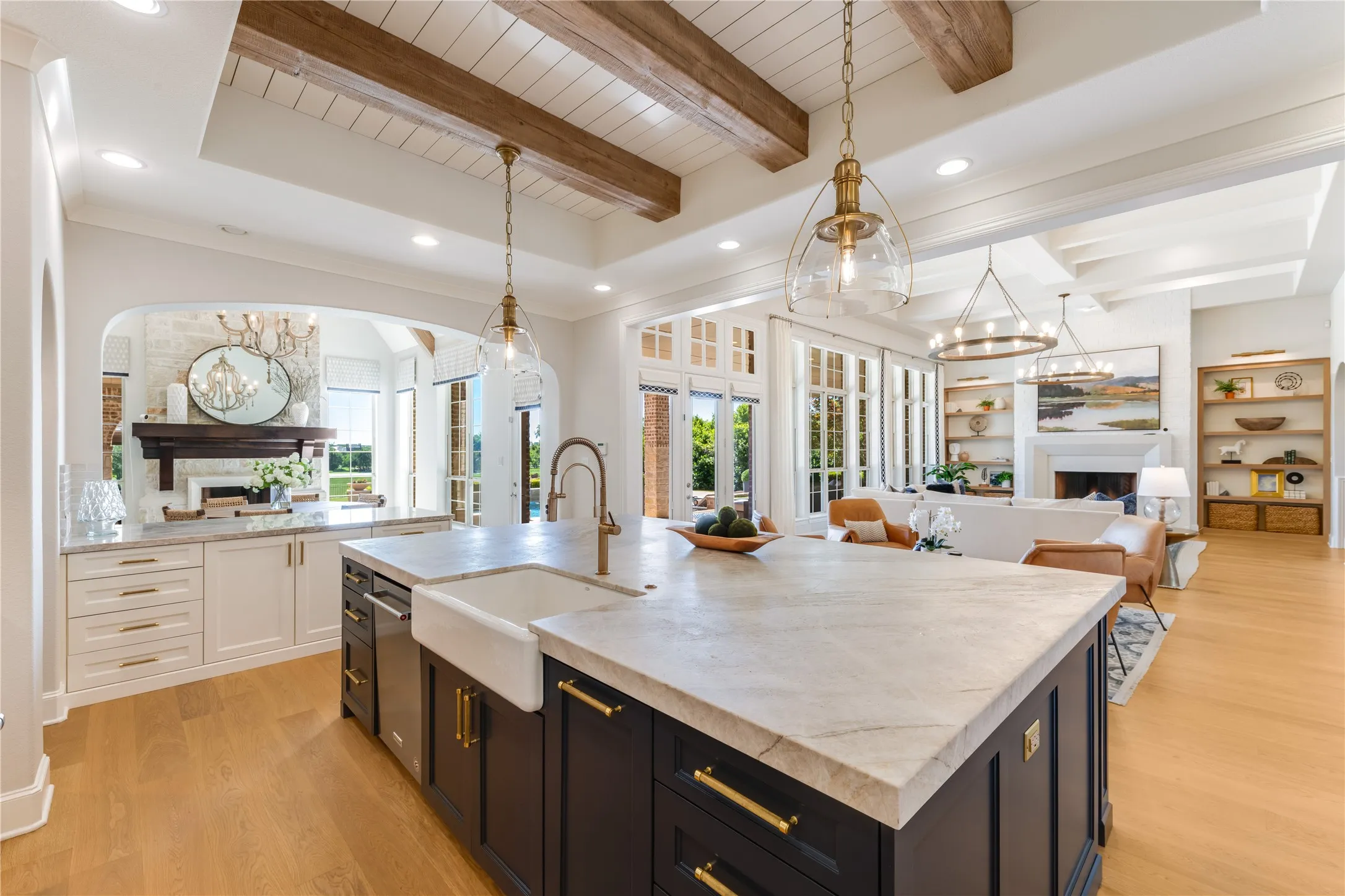 Gold plumbing fixtures & hardware on the cabinet doors. This island is massive!