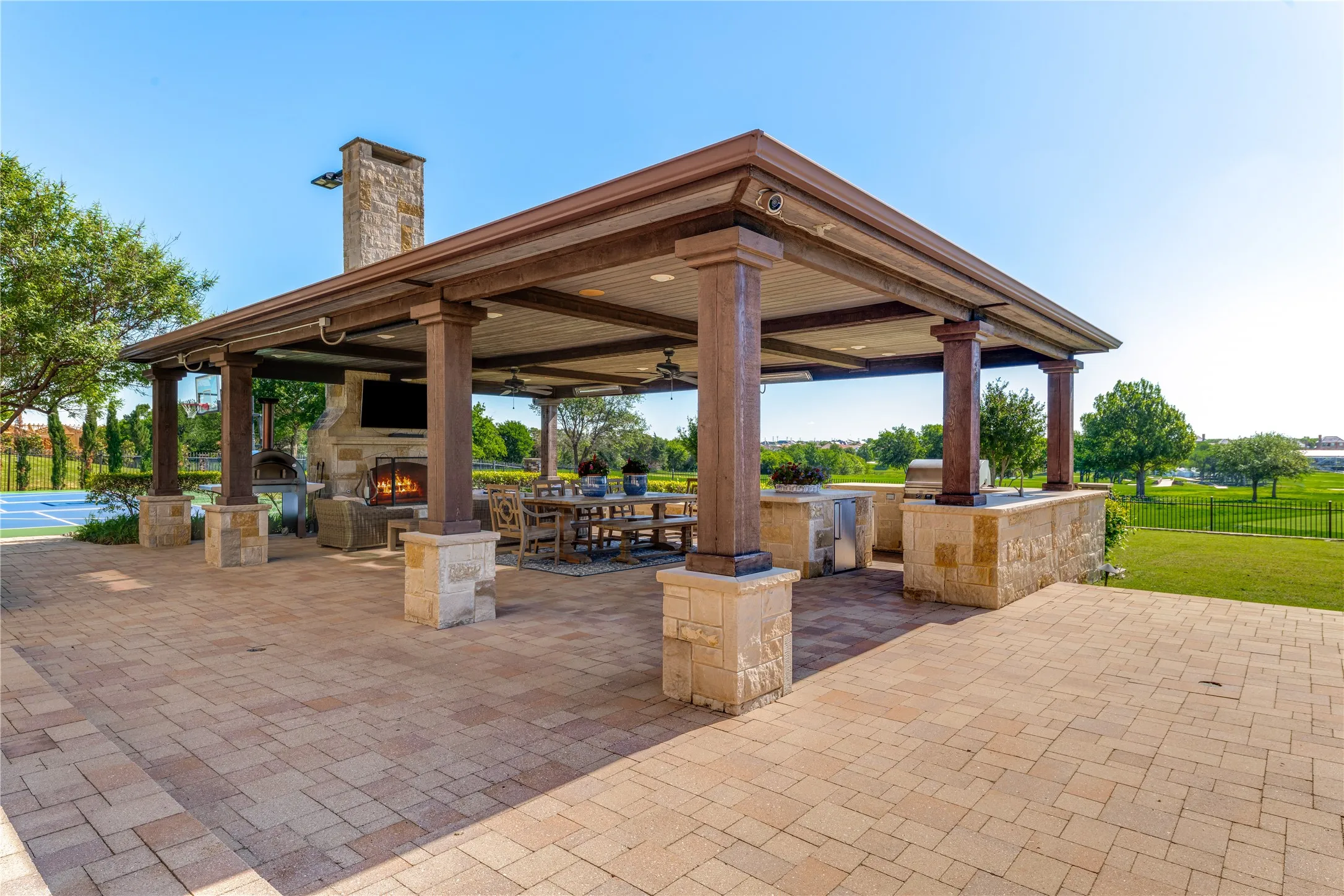 Another look at the outdoor pavilion for the ultimate in southern entertaining & the timeless calm of the golf course setting. Picture yourself hosting parties on the vast pavered patio.