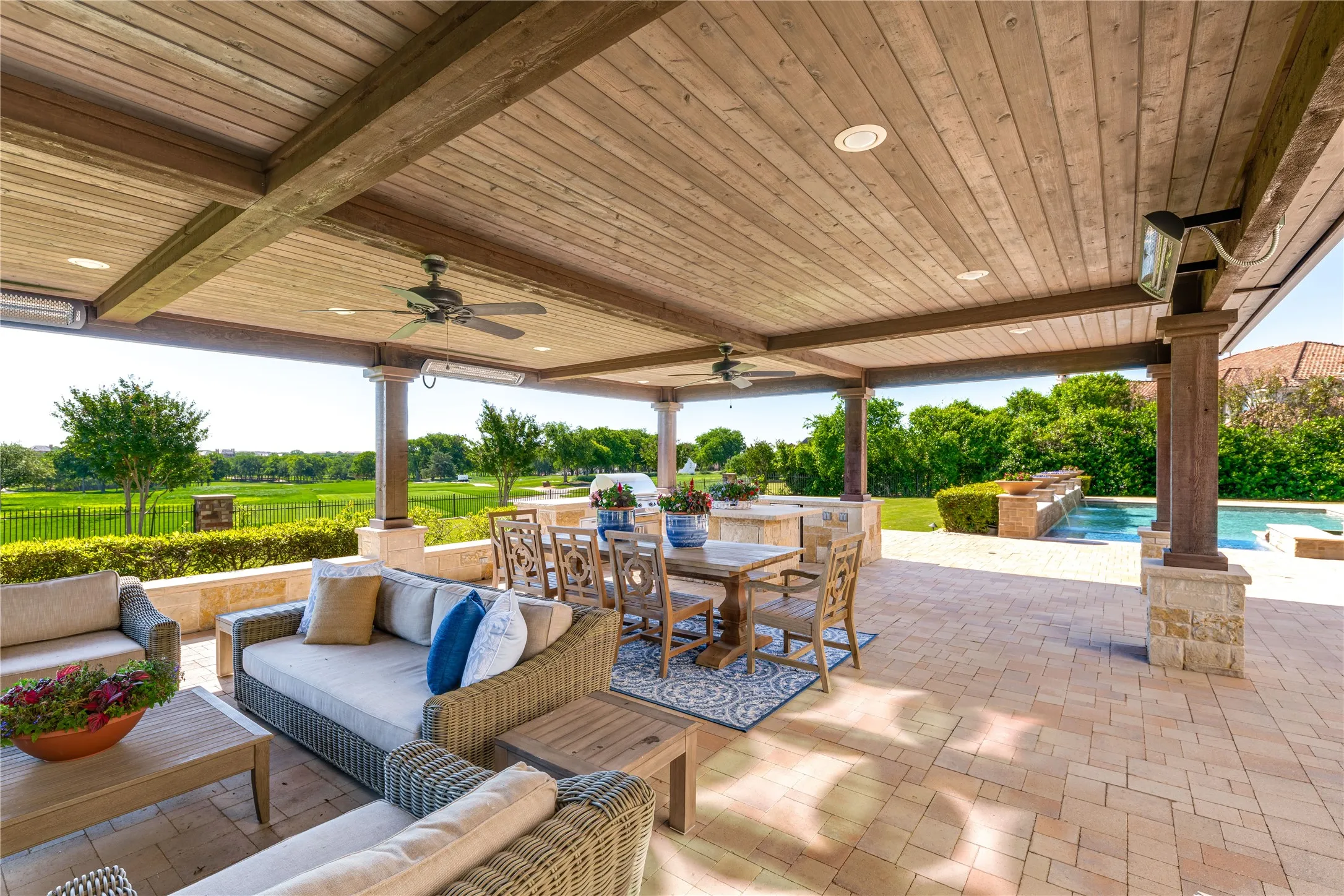 Outdoor dining includes a natural gas built-in BBQ grill + a plumbed sink, refrigerator & storage.