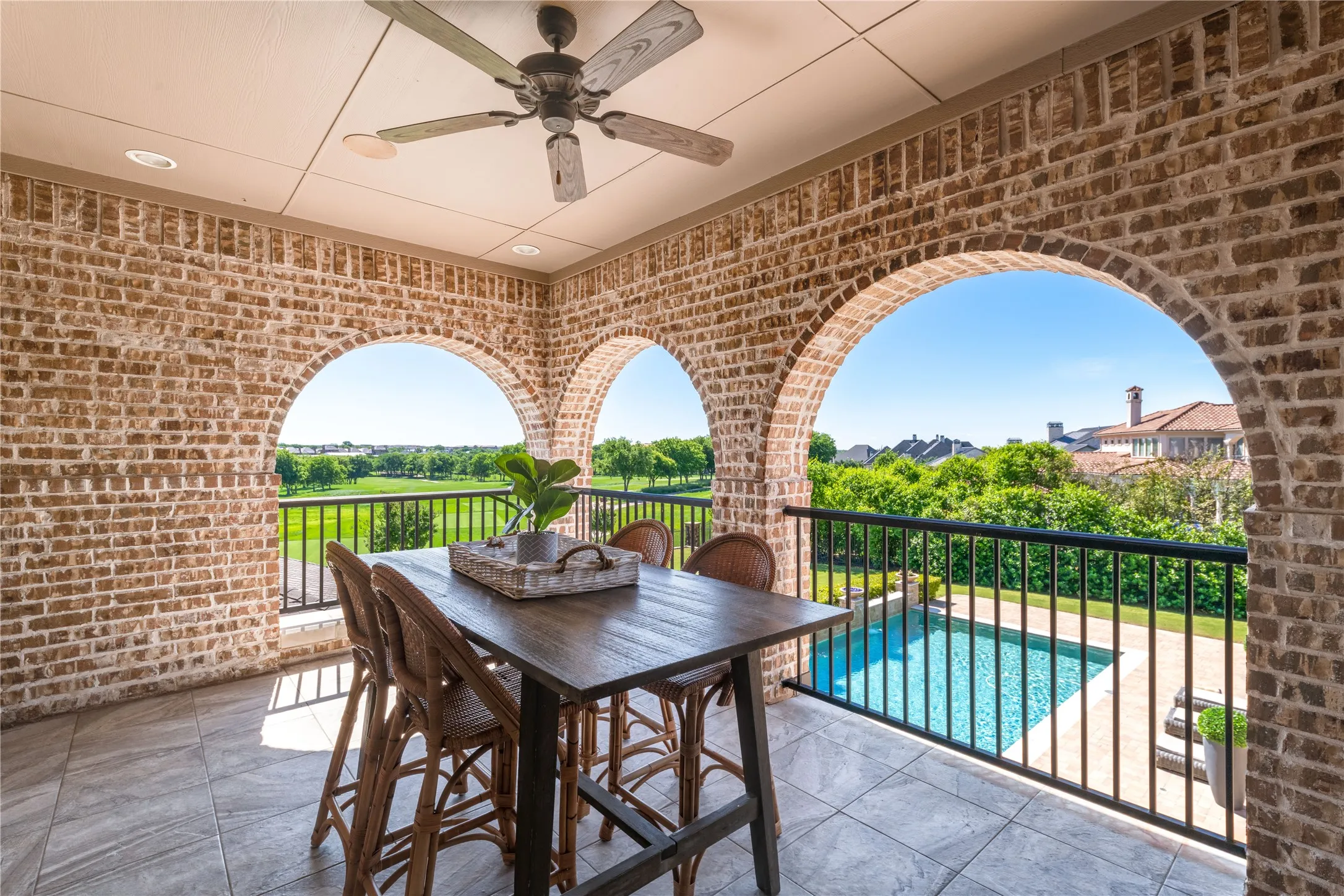 An upper balcongy overlooking the golf course offers an elevated vantage point of the mainucred fairways. Not pictured is a lower covered patio off the breakfast room---another comfortable spot for shade cover or morning beverages.