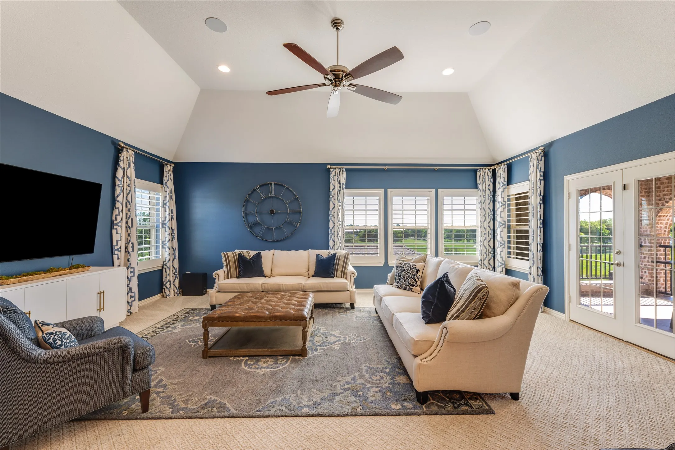 The ultimate hangout spot with plenty of room for a pool table, shuffleboard, workout equipment & more. Adjacent to this gameroom is a useful kitchenette & laundry closet. Balcony through the right doors. Two split upper bedrooms-ensuite baths & a small loft finish off the upper floor.