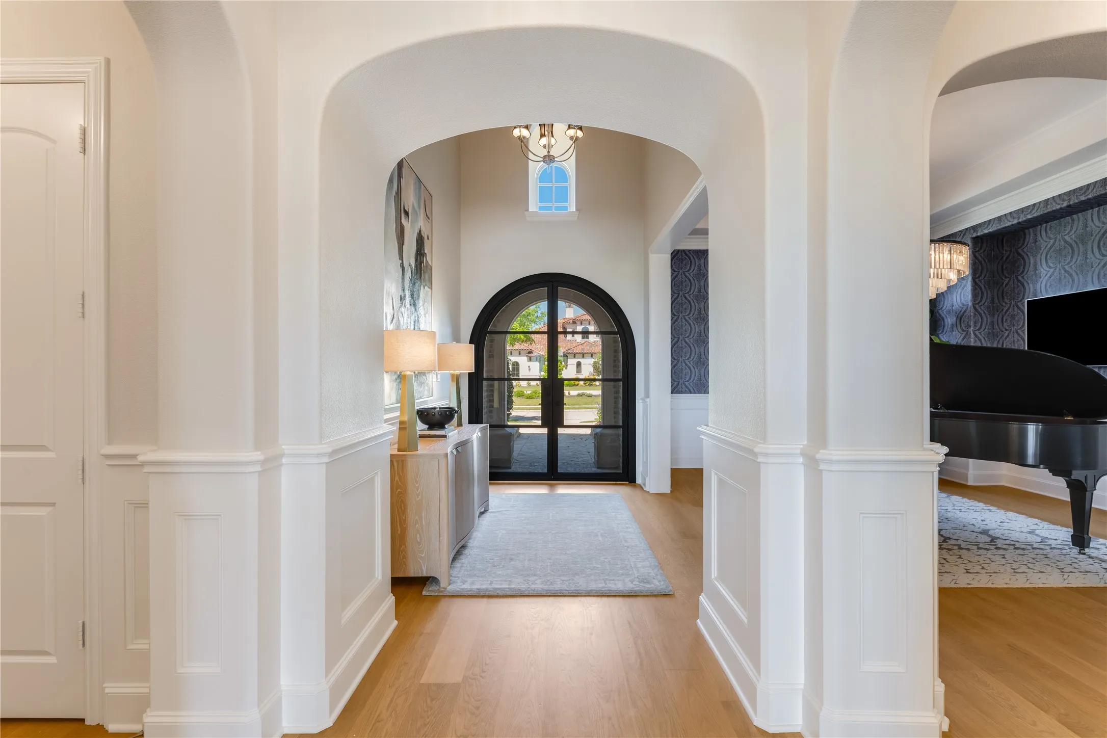 From the moment you enter from the double glass door, you'll admire the elegance of the beautiful millwork throughout this estate home. European White Oak Floors & 7" baseboards are among the designer upgrades.