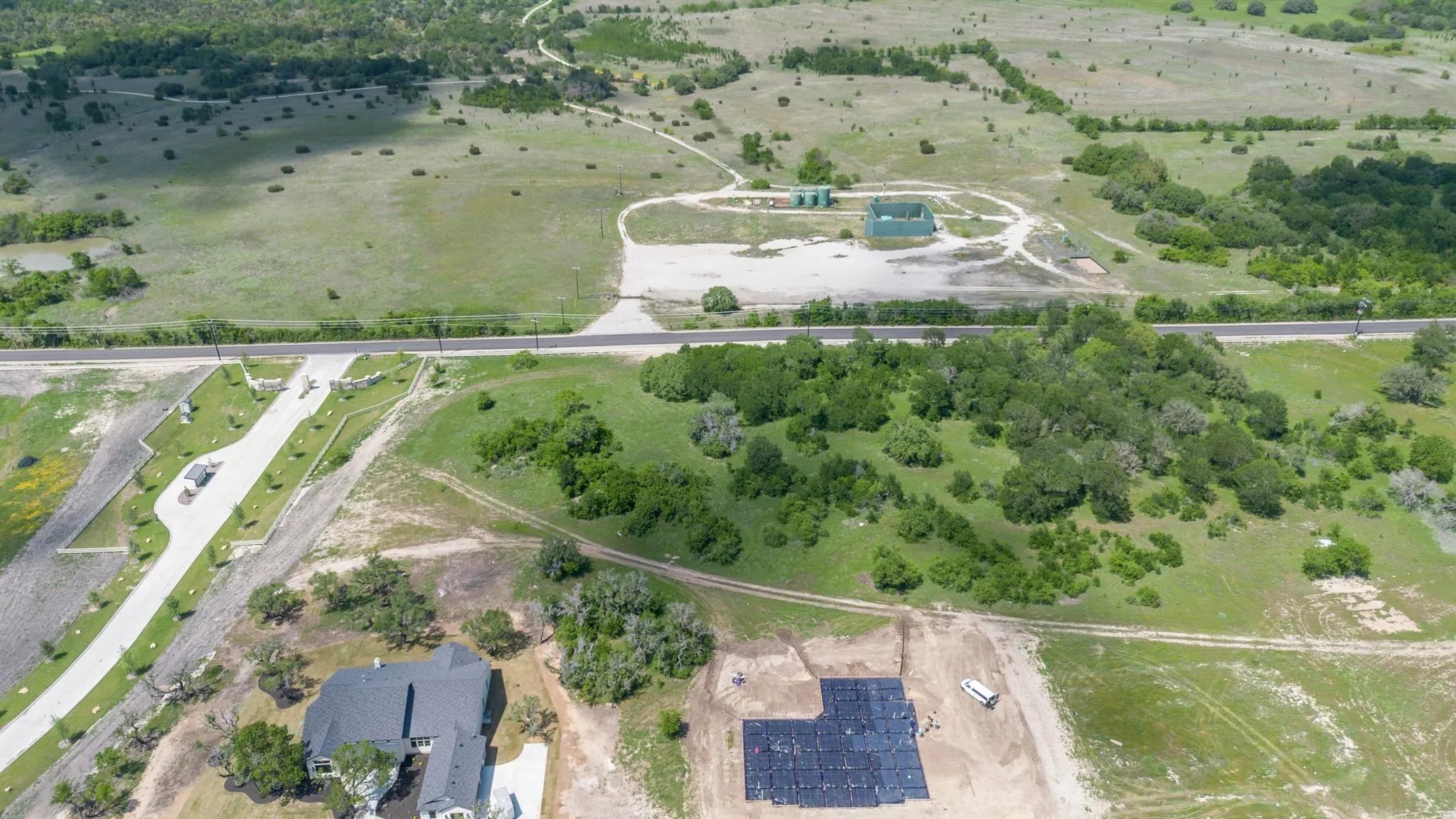 Birds eye view of property featuring a rural view