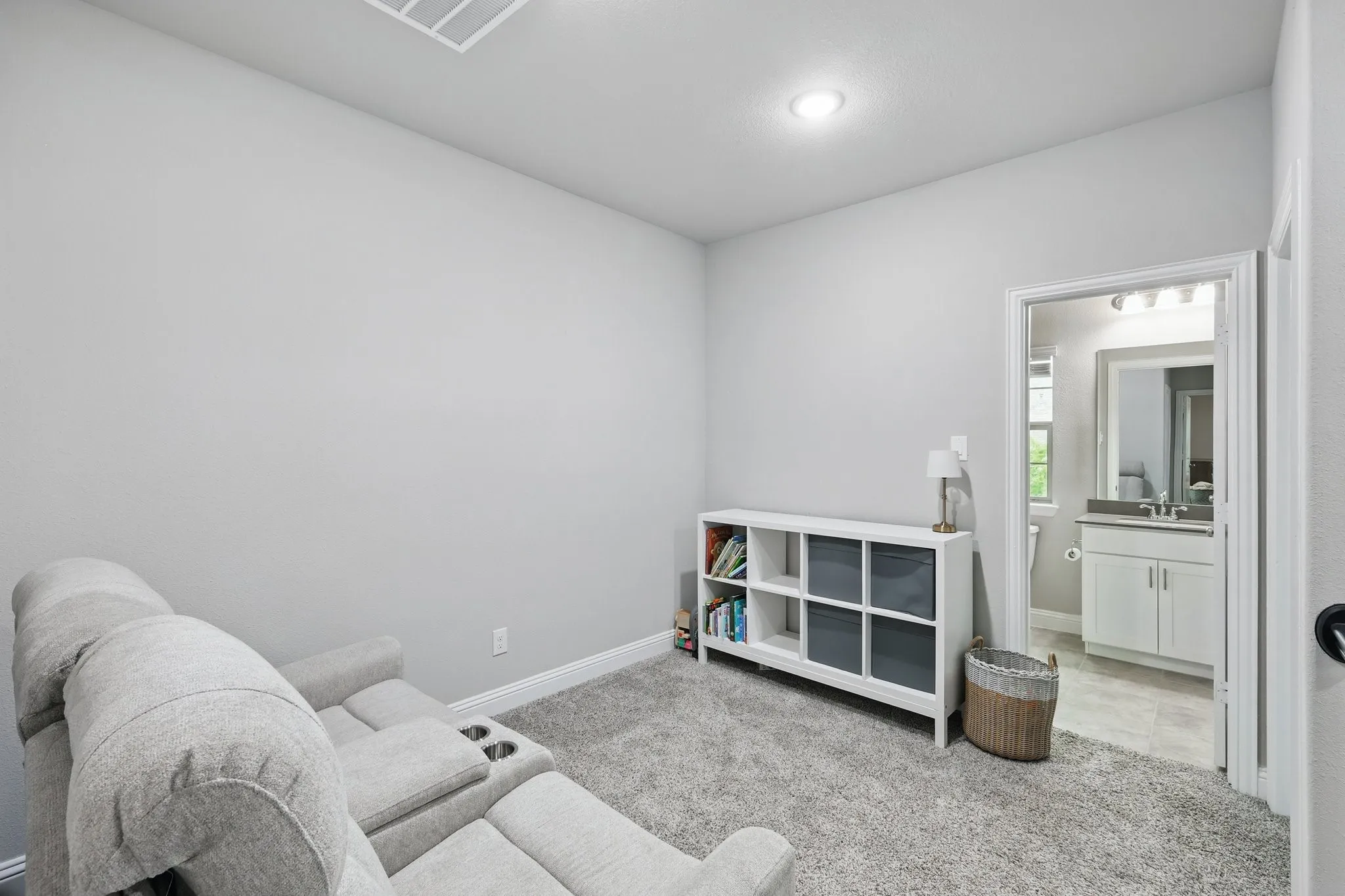 Sitting room with recessed lighting, baseboards, and carpet floors