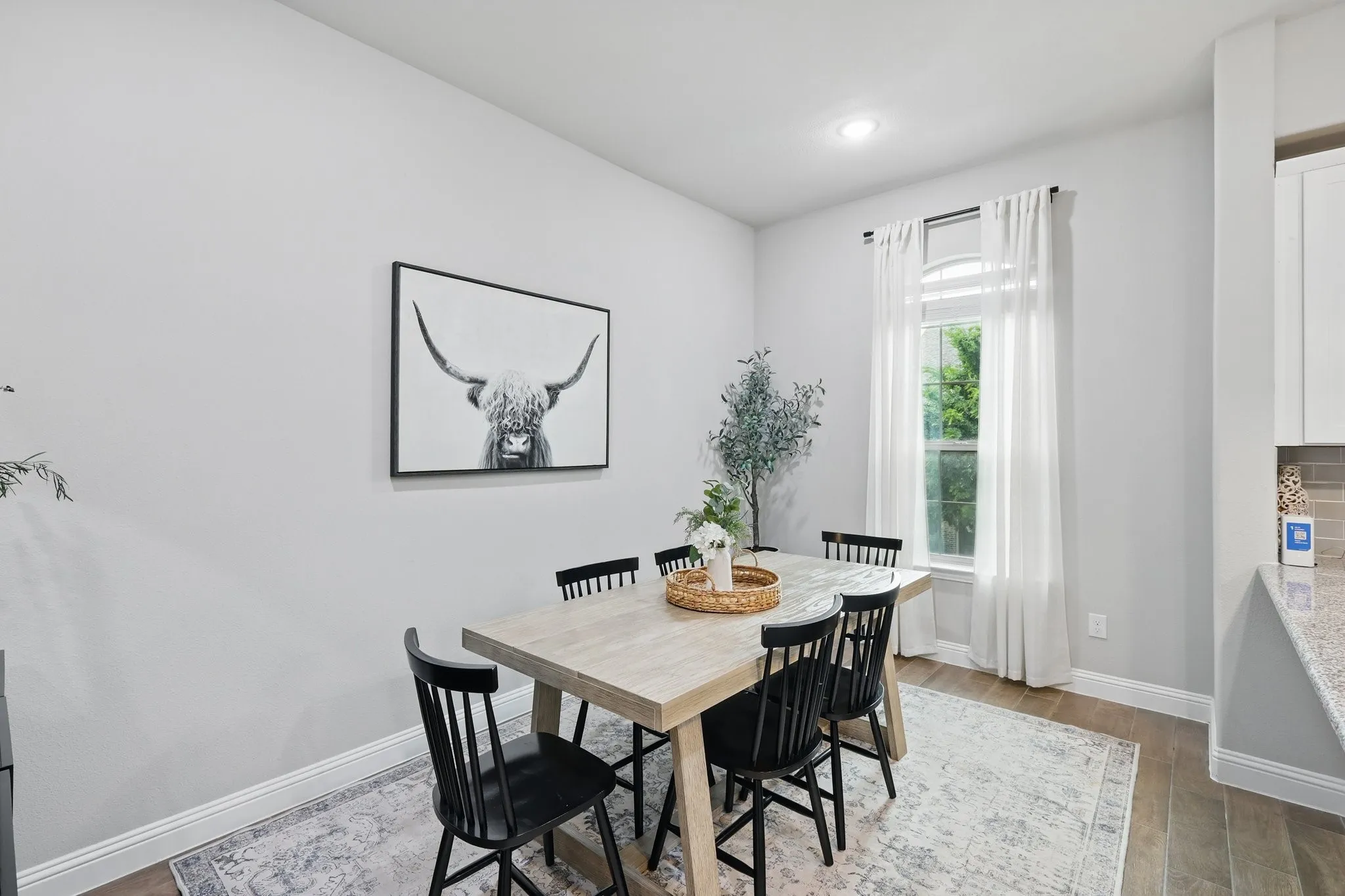 Dining space featuring recessed lighting, baseboards, and wood finished floors