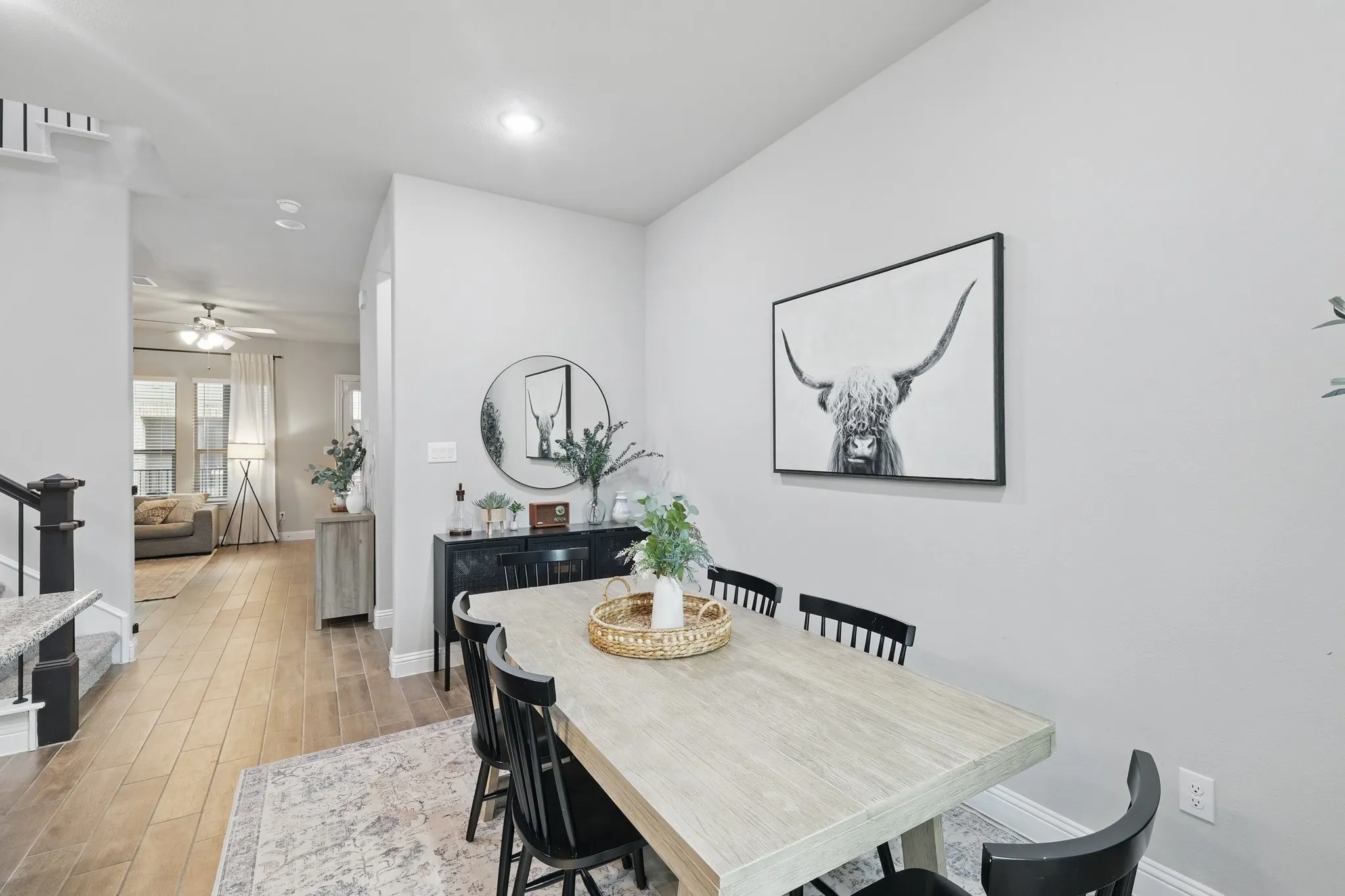 Dining space with baseboards, light wood-type flooring, a ceiling fan, and recessed lighting