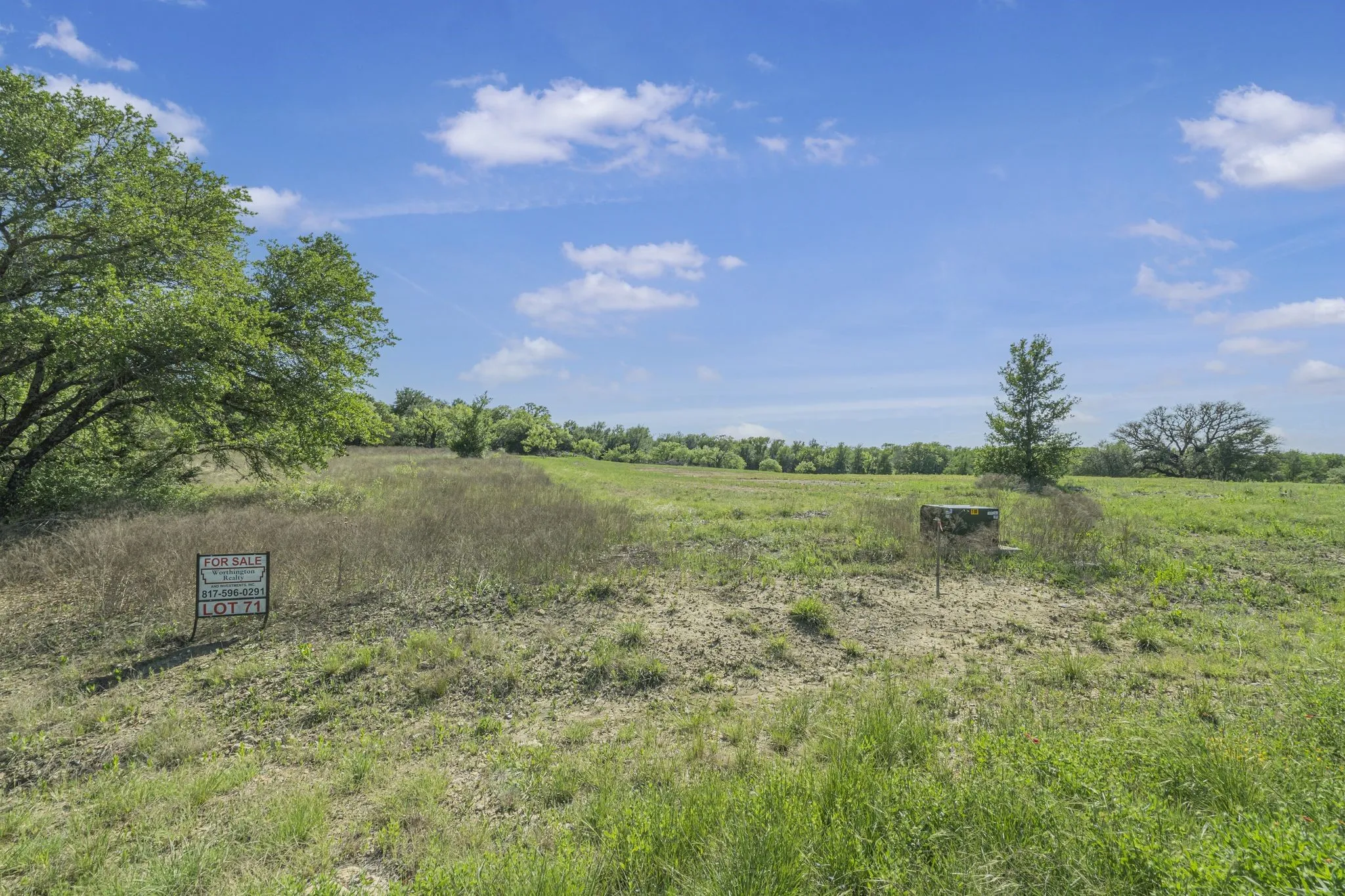 View of yard with a rural view