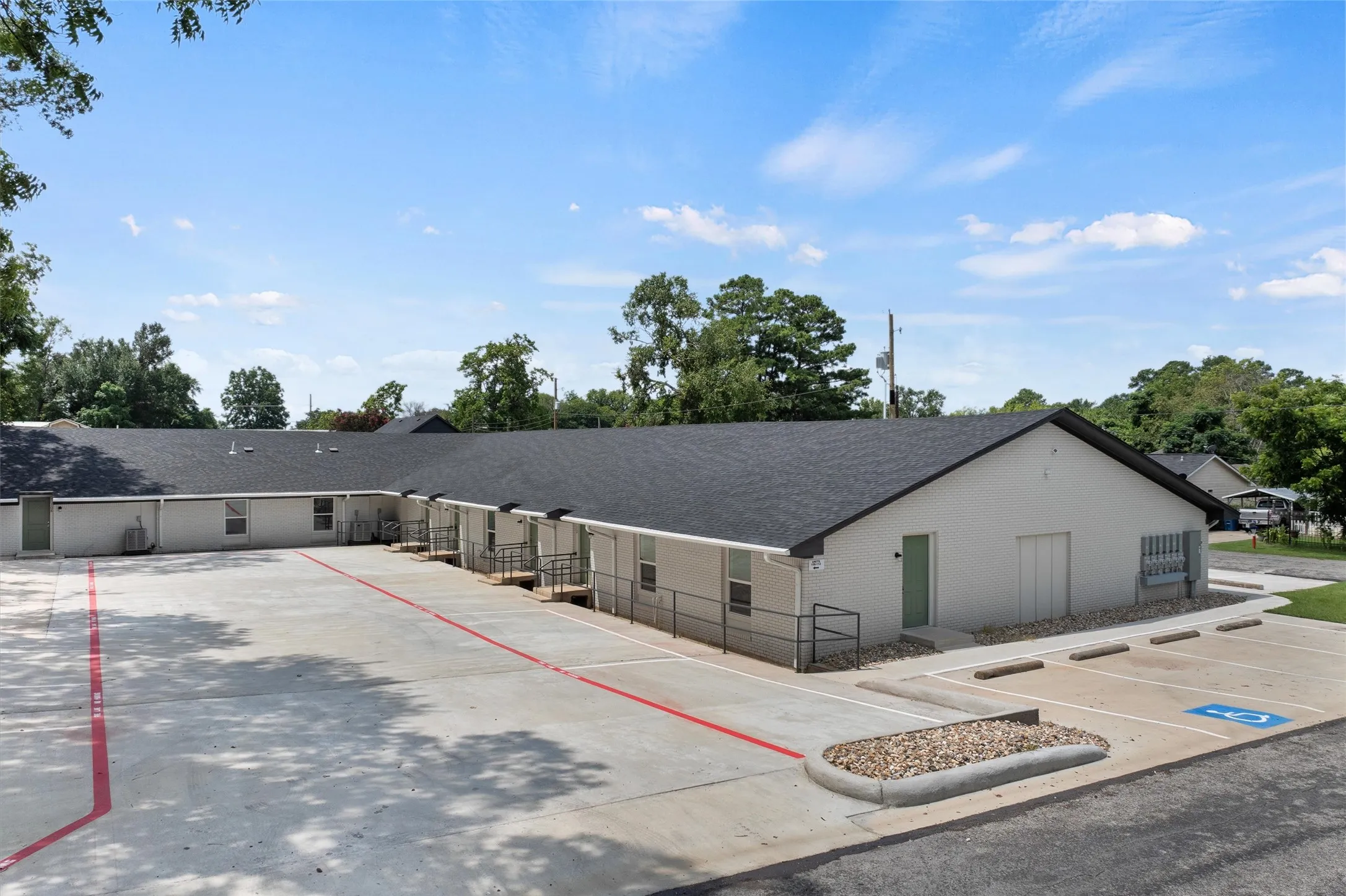 View of property with uncovered parking