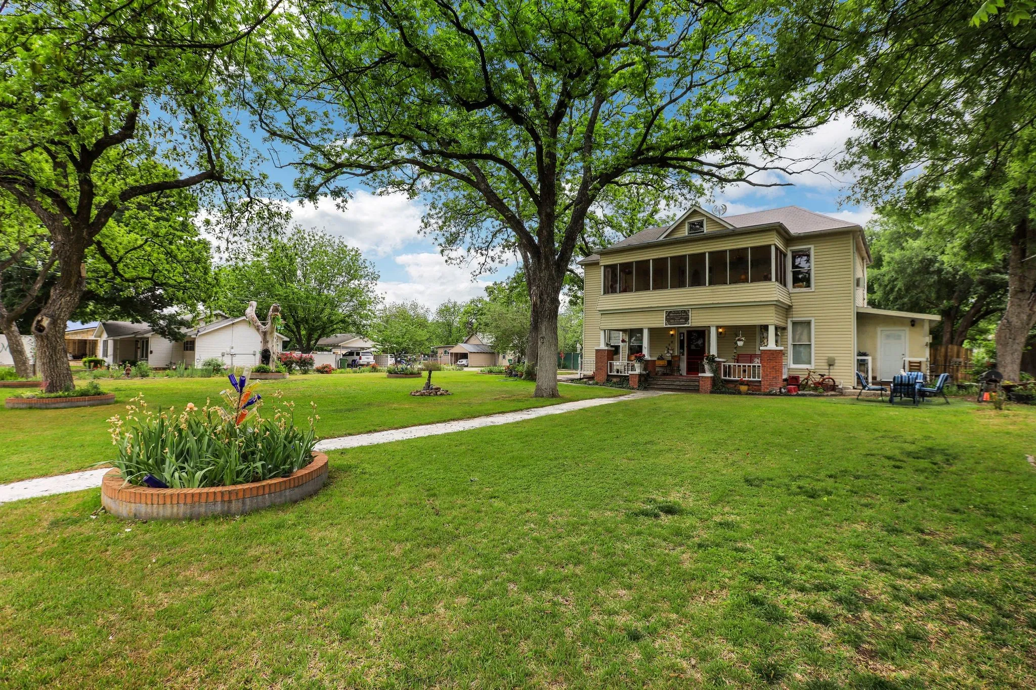 View of yard with a sunroom