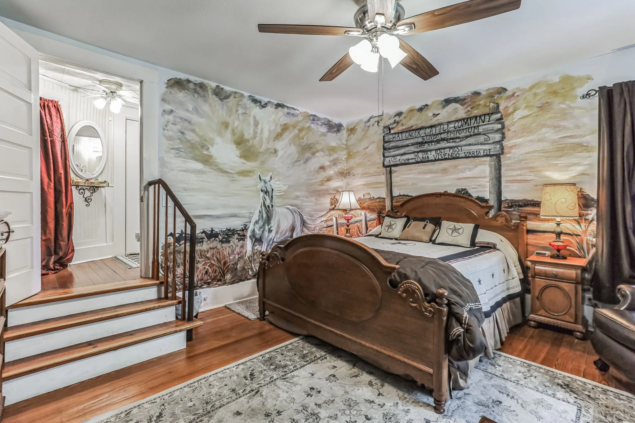 Bedroom with ceiling fan and wood finished floors