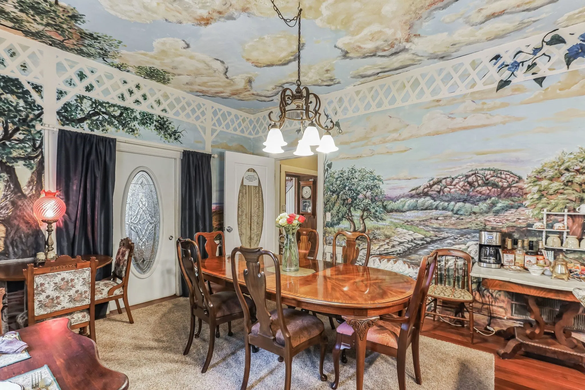 Dining space with a chandelier and wood finished floors