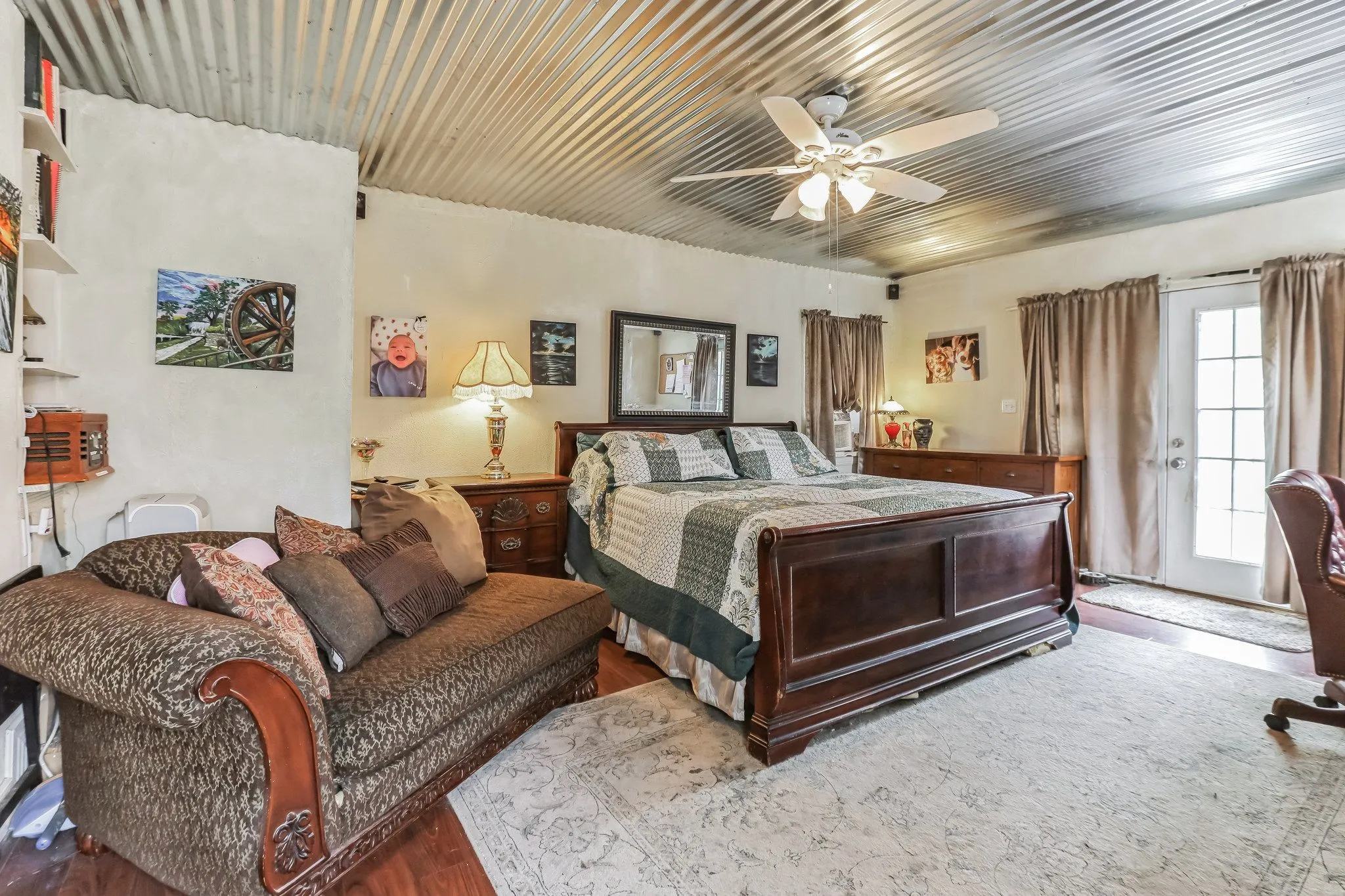 Bedroom with access to exterior, a ceiling fan, wood finished floors, and wood ceiling