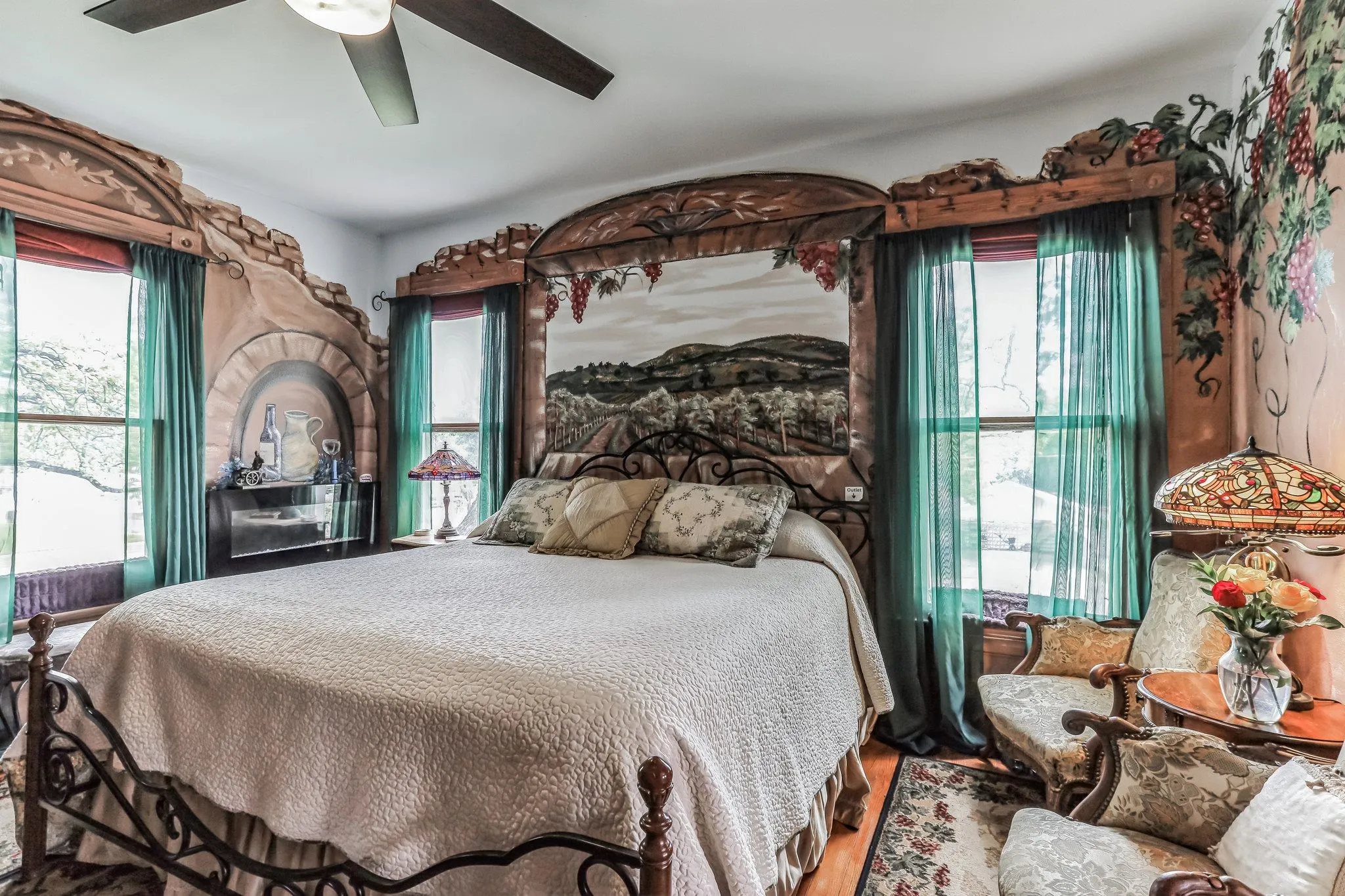 Bedroom featuring wood finished floors and ceiling fan