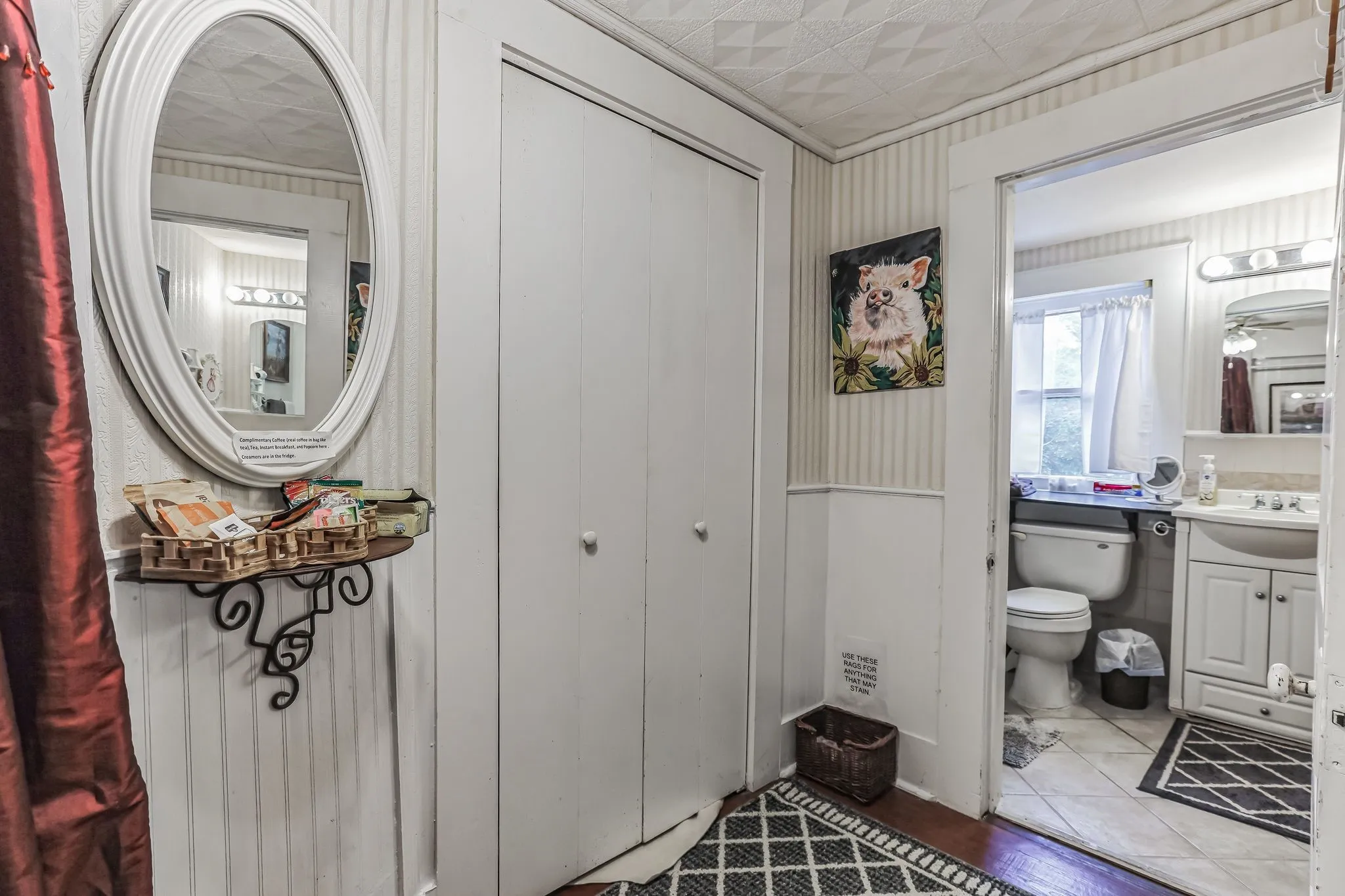 Bathroom with an ornate ceiling, visible vents, toilet, and vanity