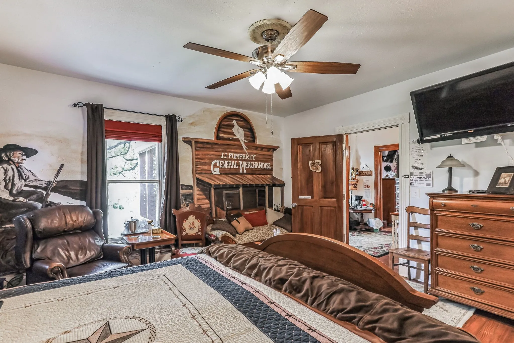 Bedroom featuring a ceiling fan and wood finished floors