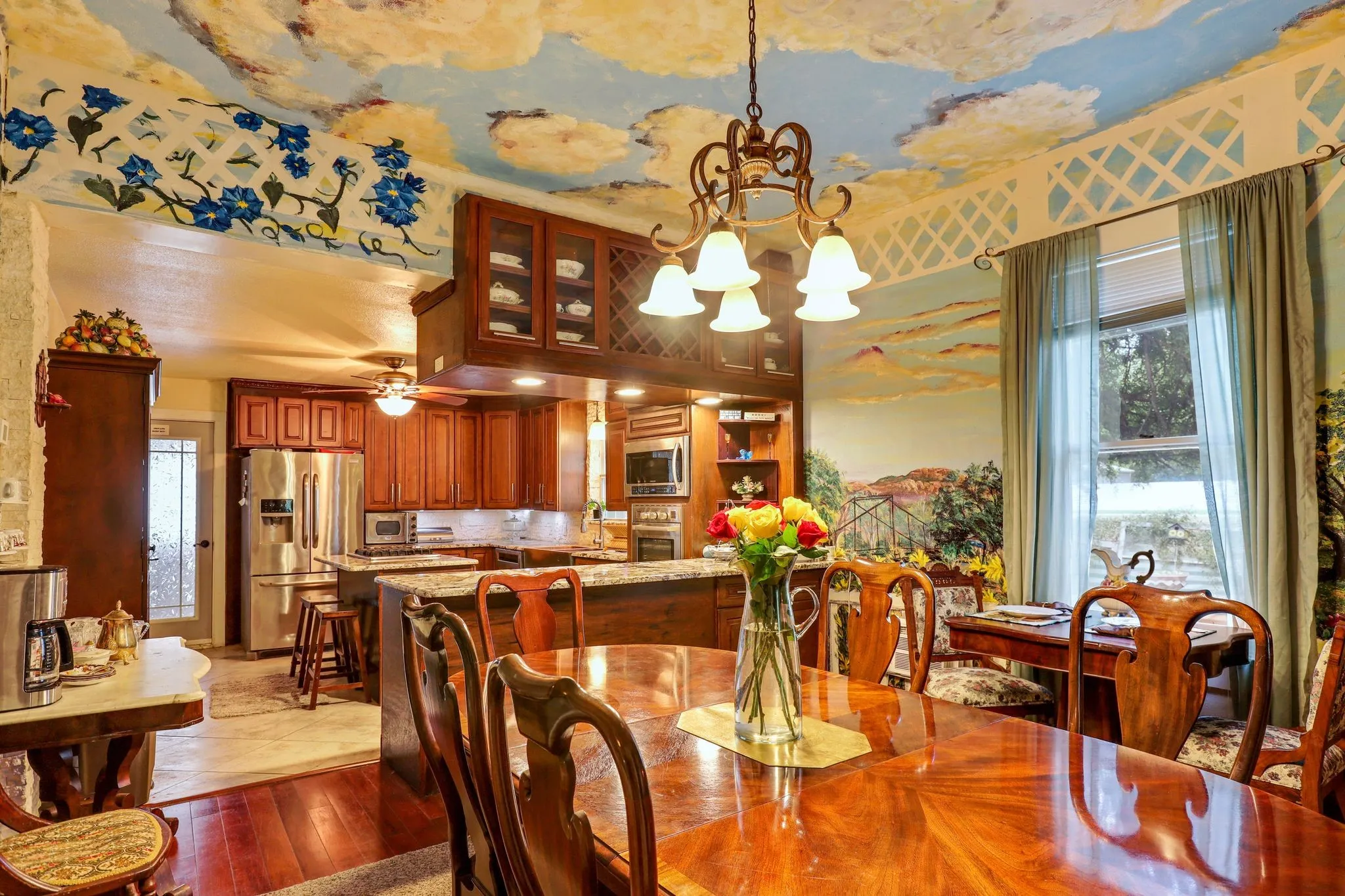 Dining area featuring an inviting chandelier and light wood-style floors