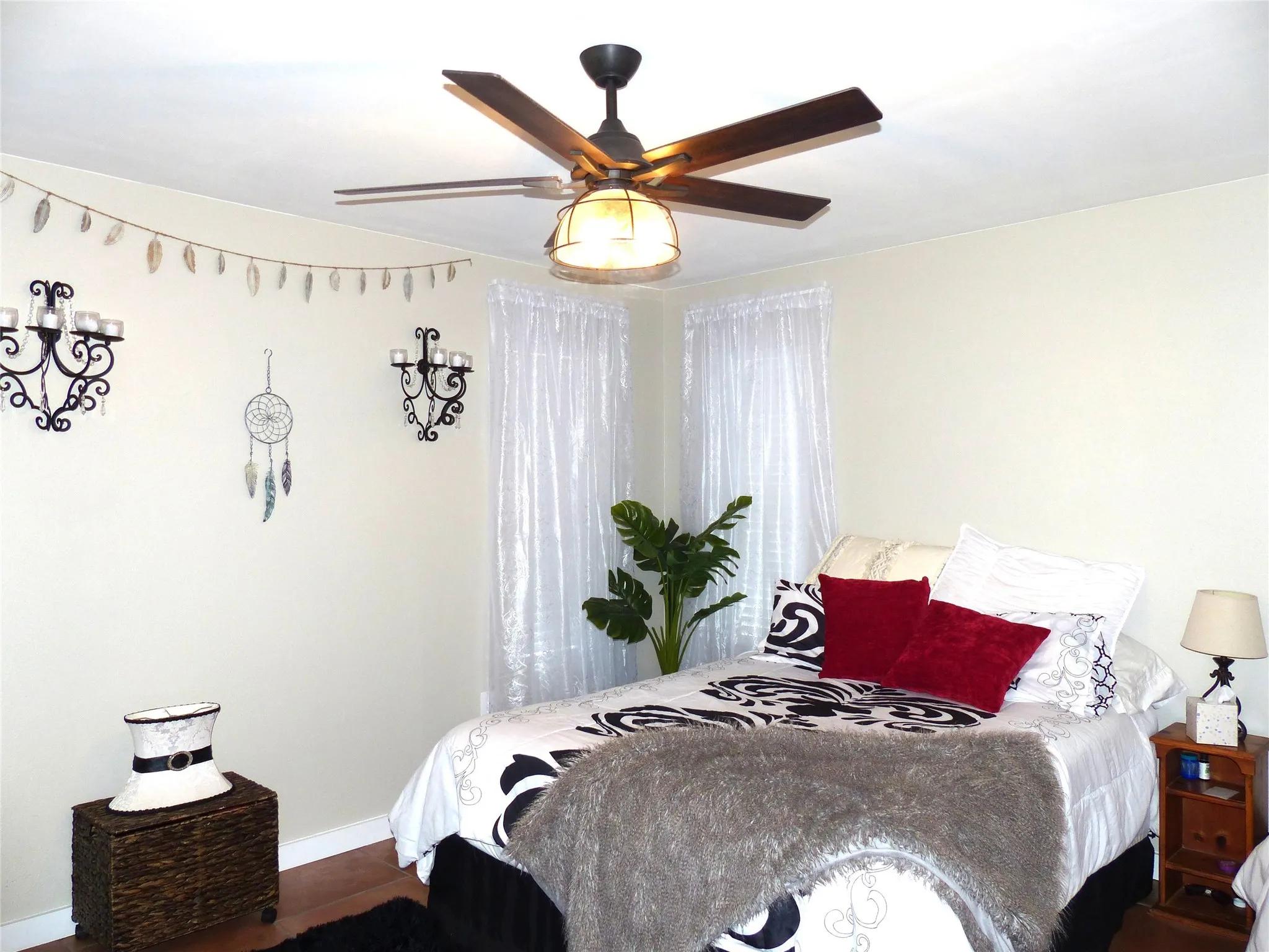 Bedroom featuring ceiling fan and wood finished floors