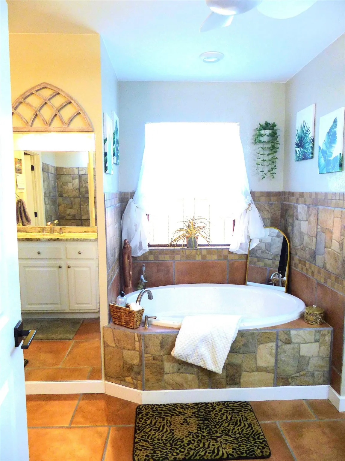 Bathroom with a bath and vanity
