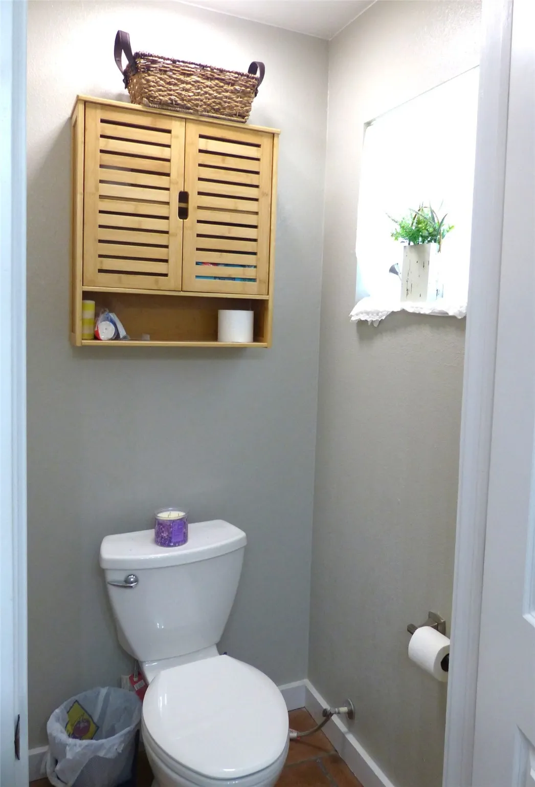 Bathroom featuring baseboards and toilet
