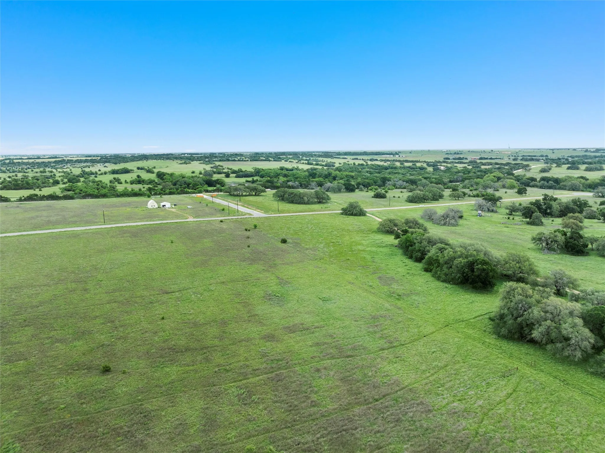 Birds eye view of property with a rural view