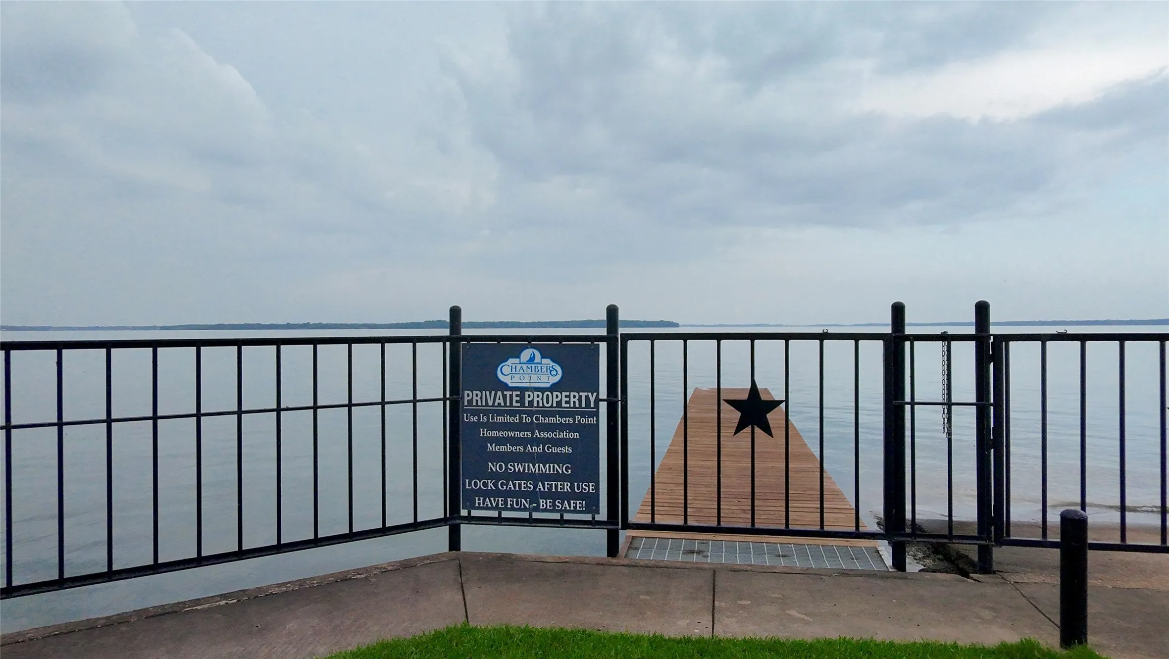 View of gate with a water view
