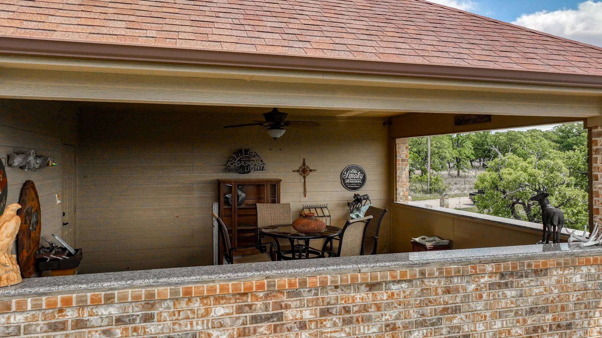 View of patio featuring ceiling fan and a balcony