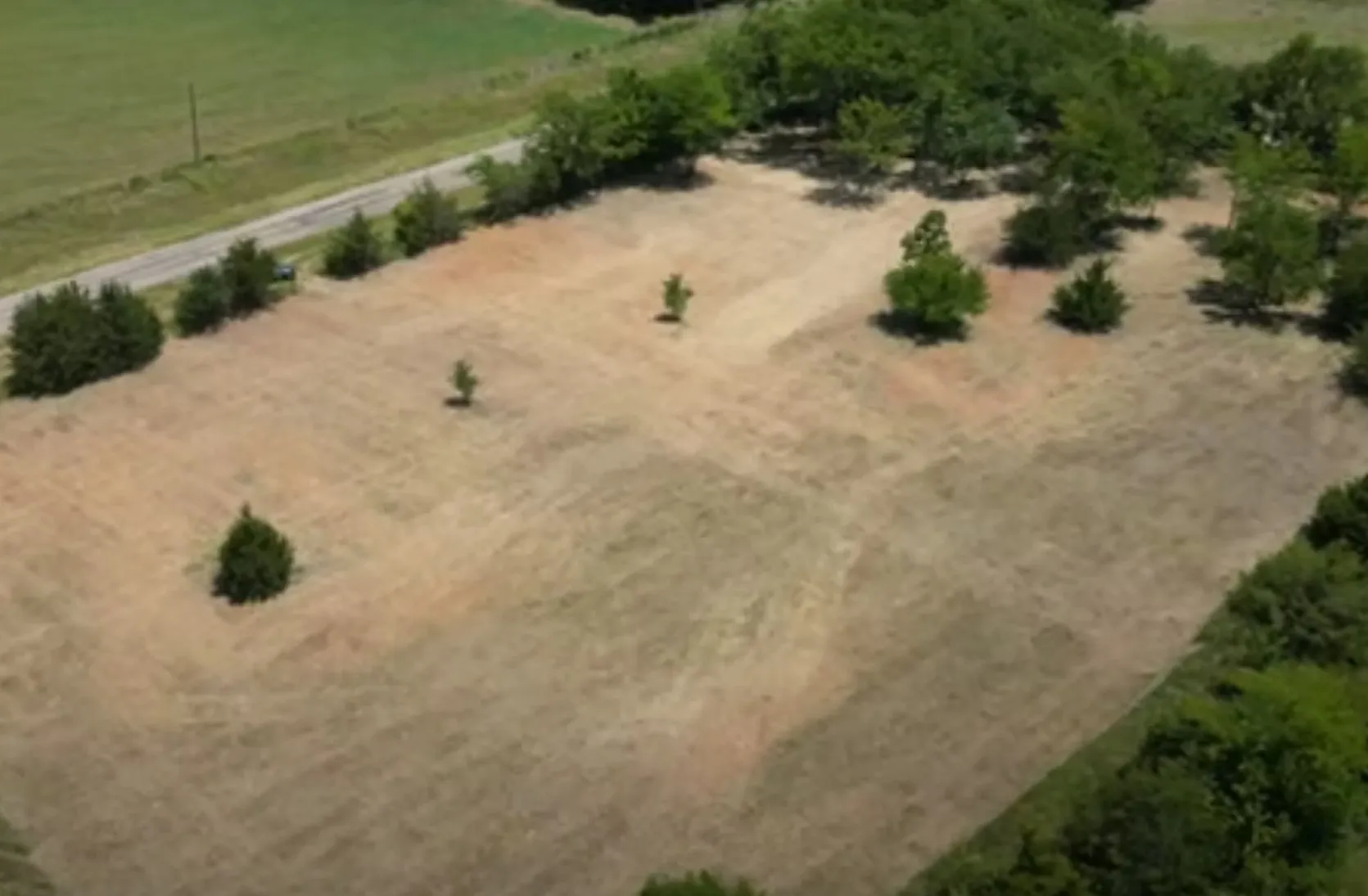 Birds eye view of property with a rural view