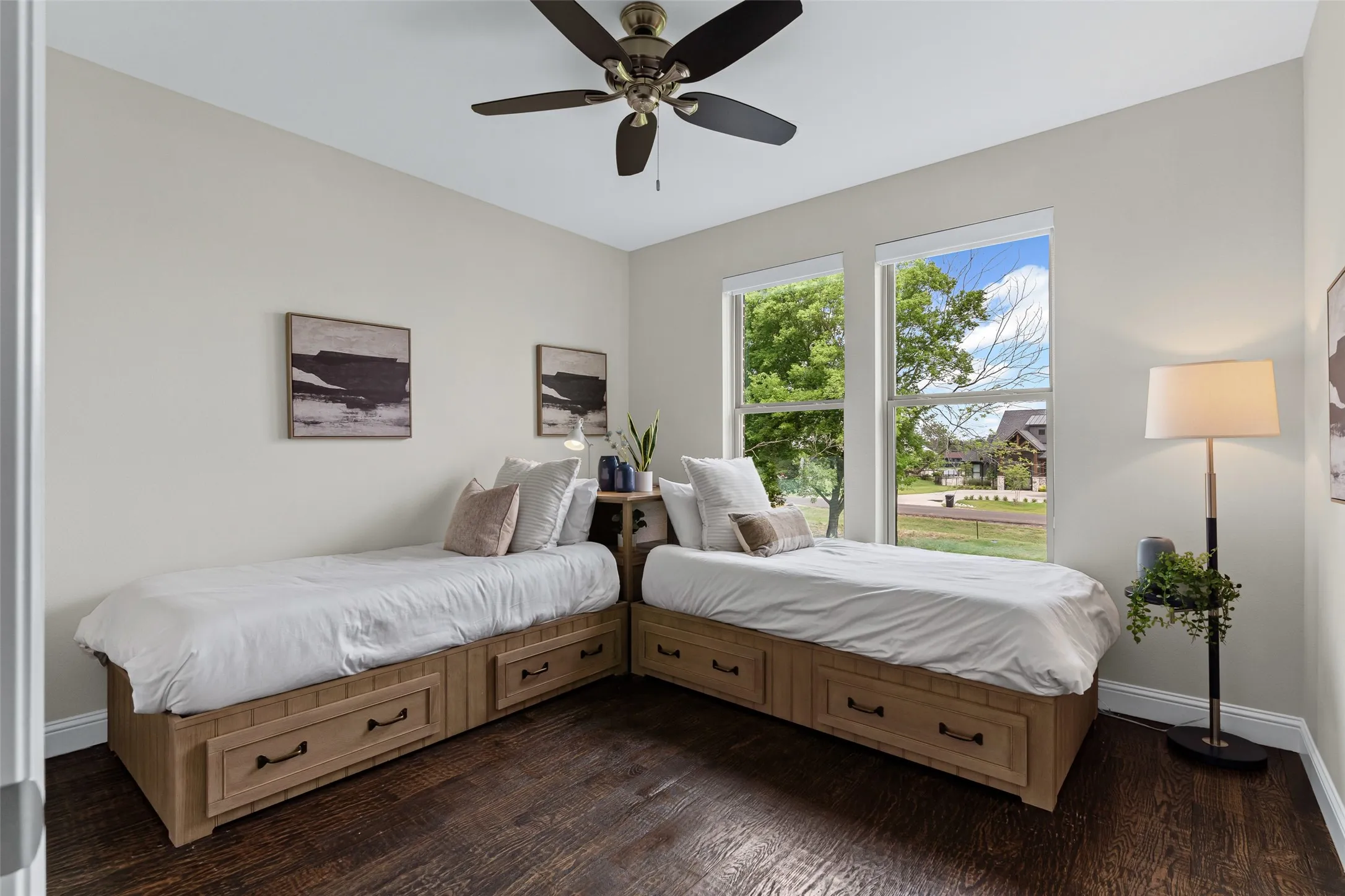 The third bedroom faces the front of the home, offering natural light, hardwood floors, and a large walk-in closet.