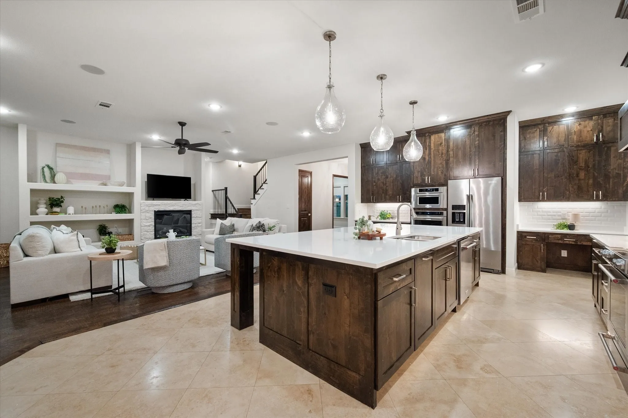 The open concept design connects the kitchen, dining, and living spaces, creating an ideal gathering place for family and friends.