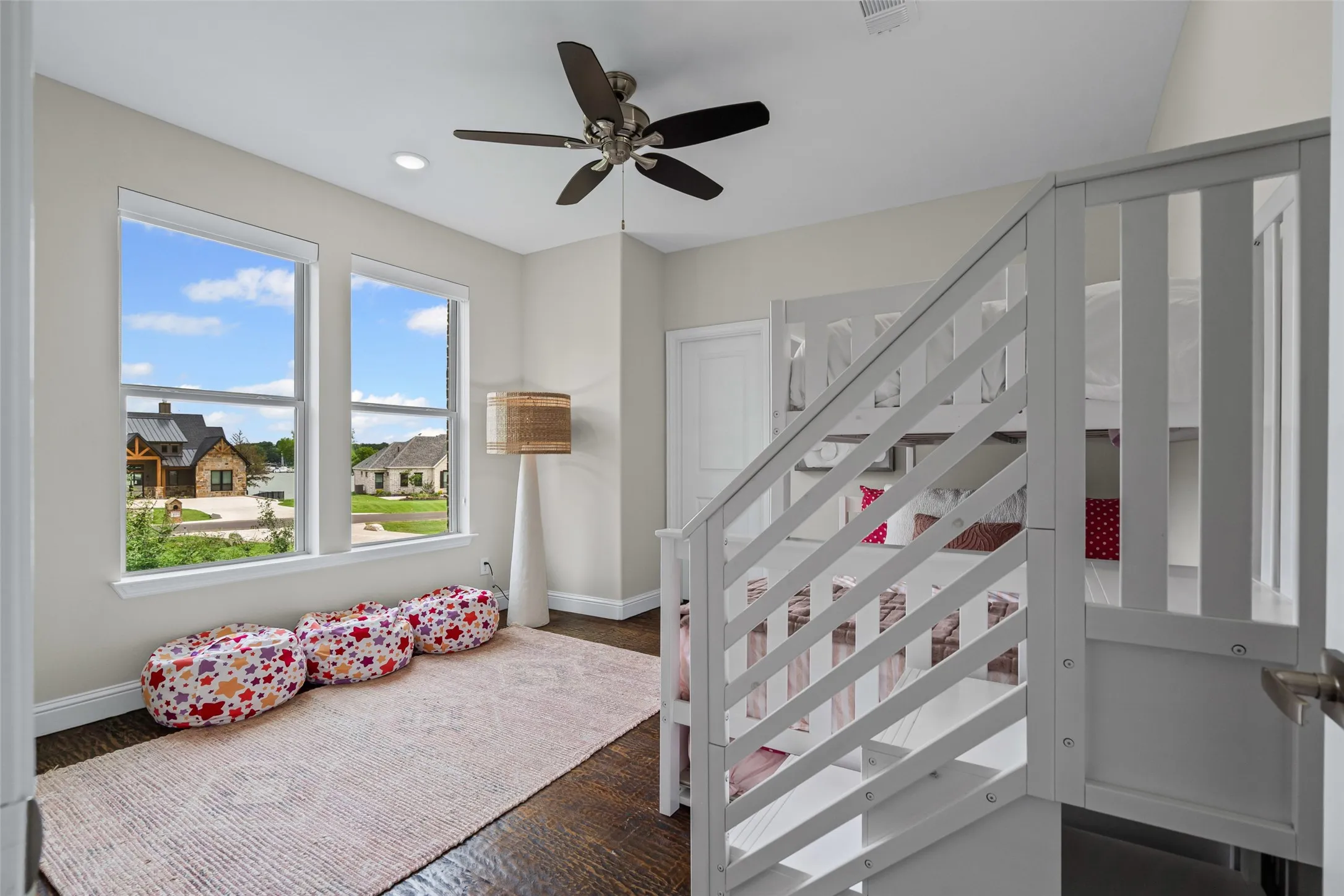Bright and versatile, the fourth bedroom offers ample space and storage with a walk-in closet.