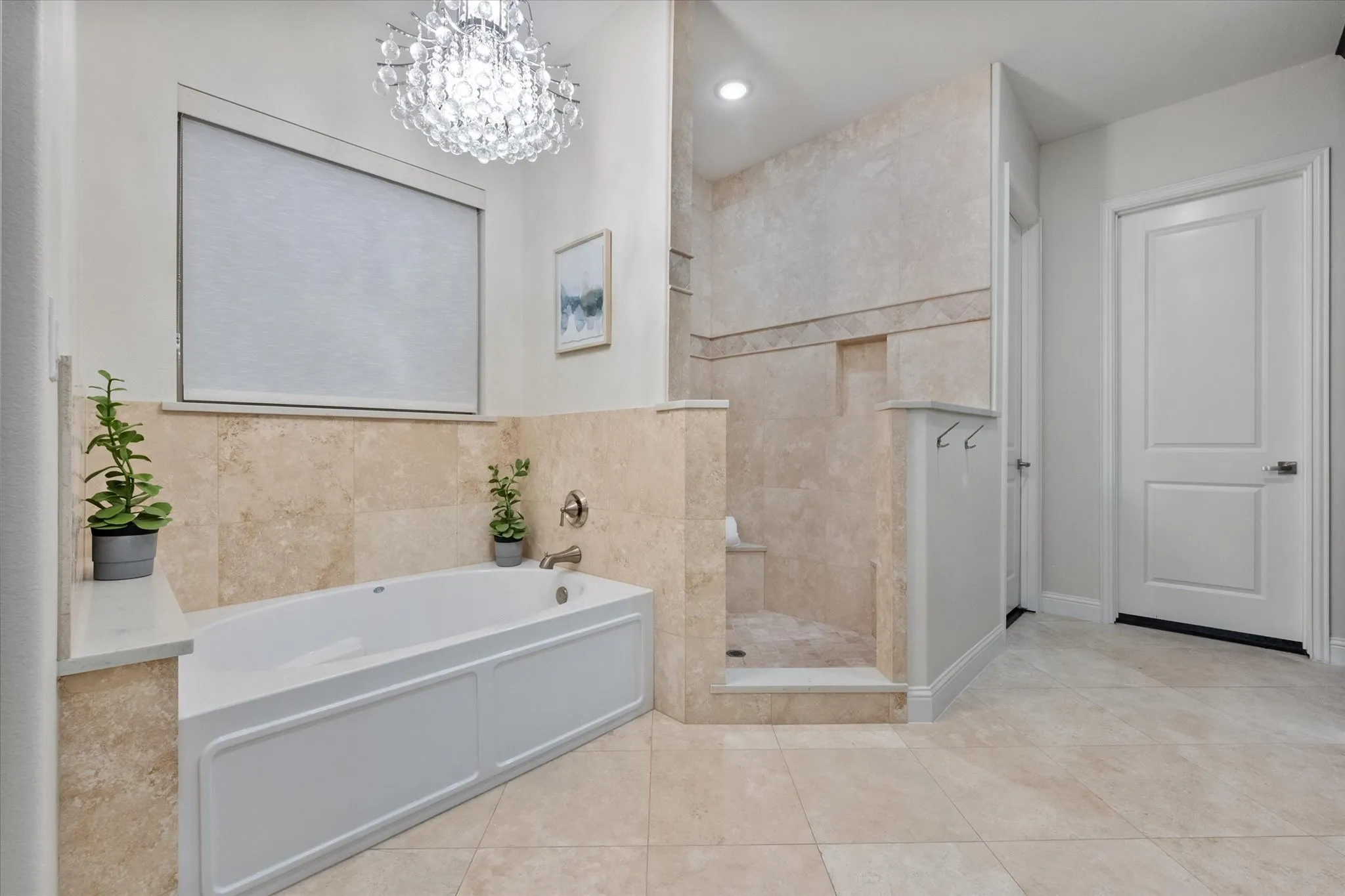 A spa-like bath with soaking tub, walk-in shower, and designer finishes creates a relaxing escape.