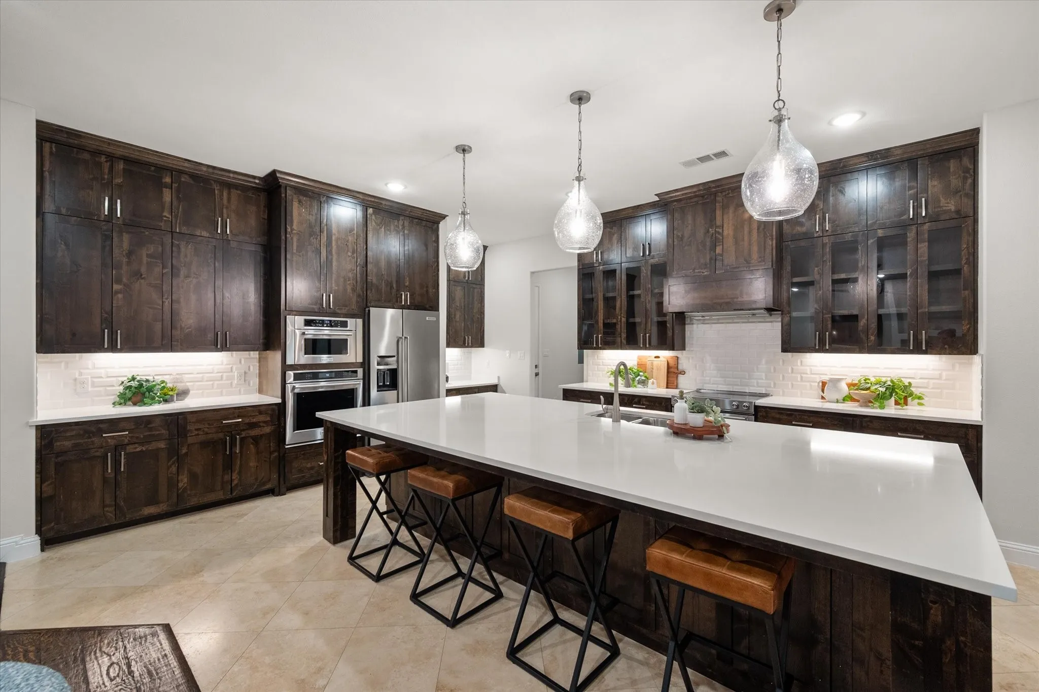 Outfitted with KitchenAid appliances, abundant cabinetry, and a spacious layout, this kitchen is designed for both function and style.