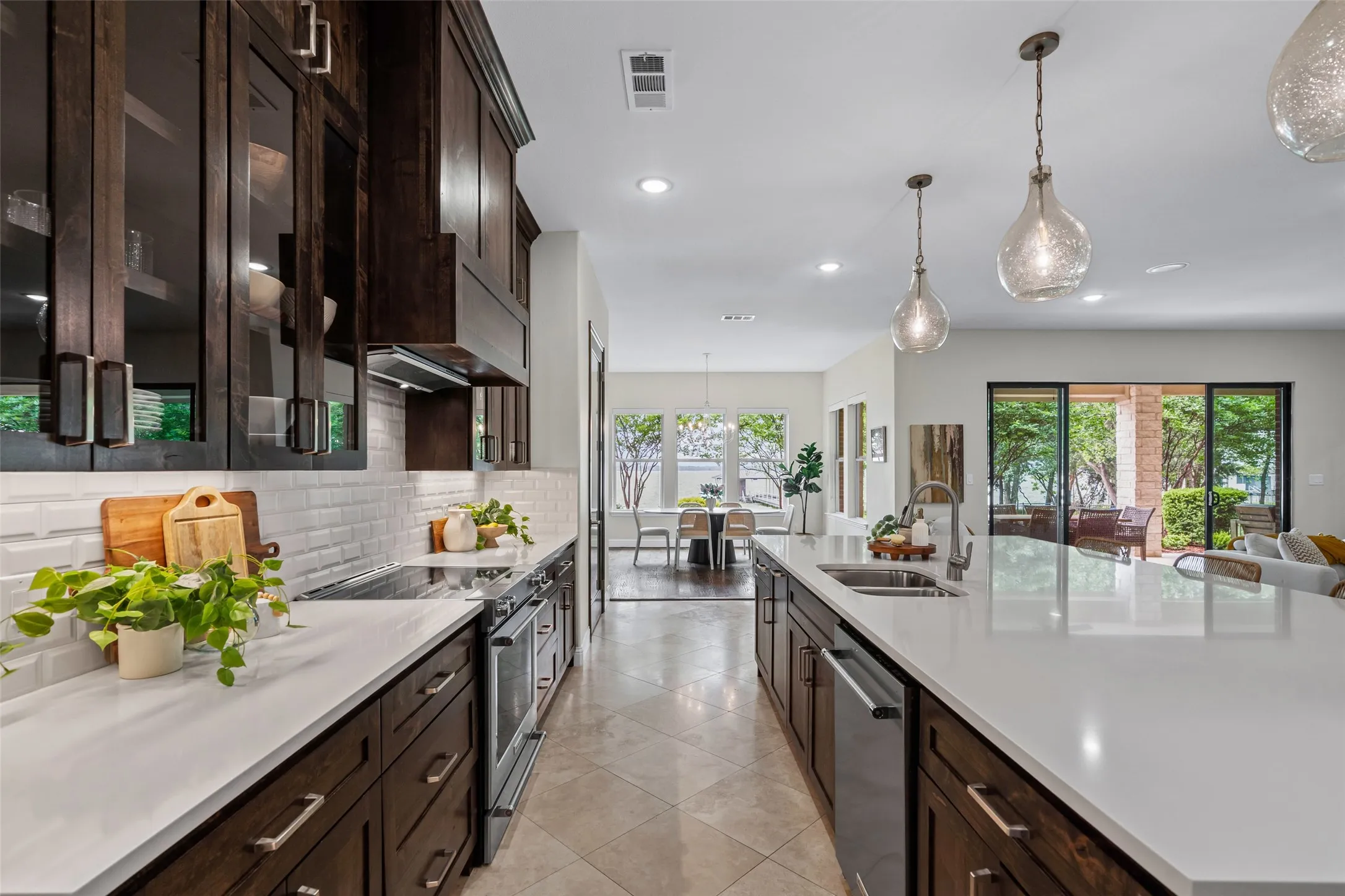 The kitchen offers a generous workspace with a natural connection to the living and dining areas, ideal for gatherings and everyday living.