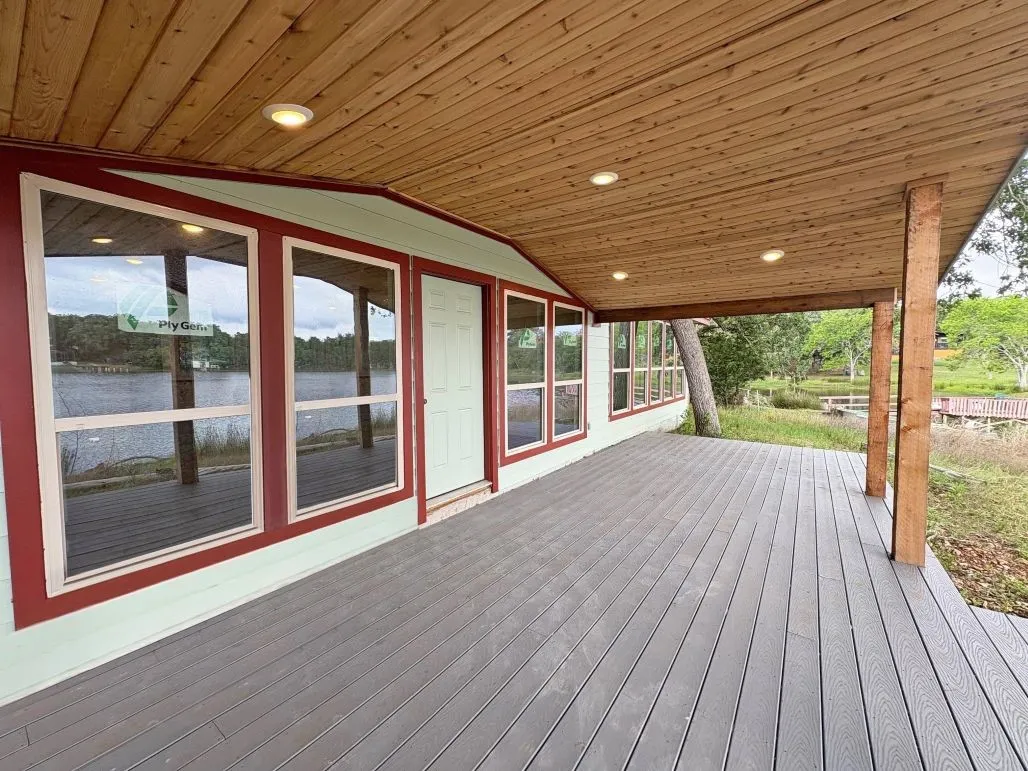 Wooden deck featuring a water view