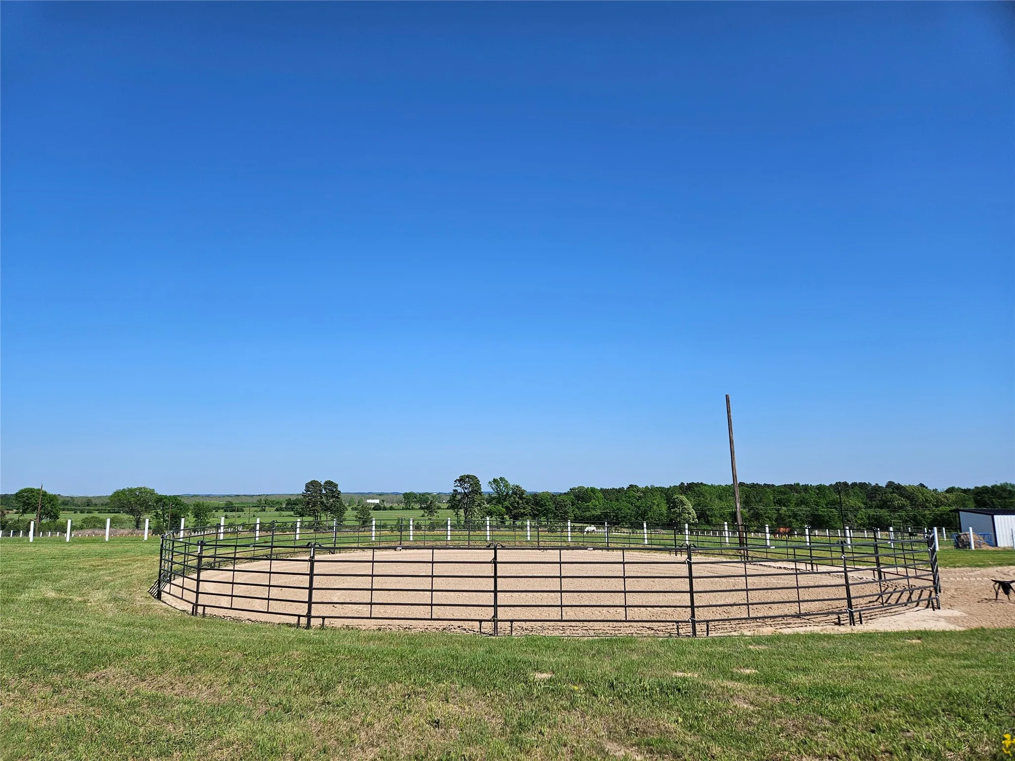View of yard featuring a rural view and an enclosed area