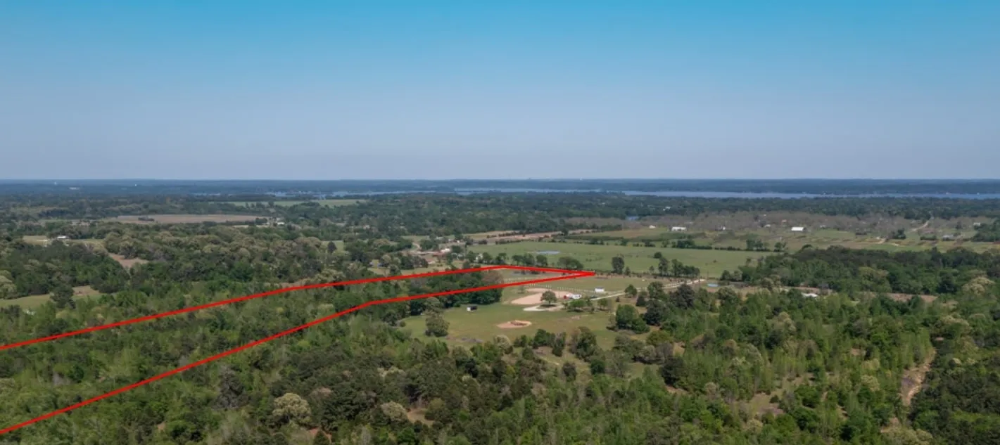 Birds eye view of property featuring a rural view
