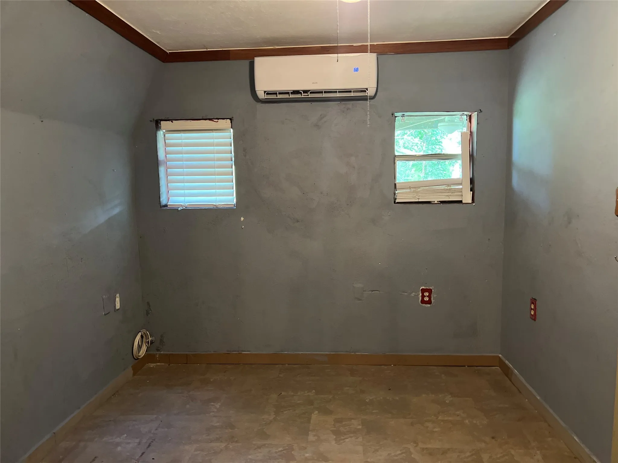 Empty room featuring Located on the first floor. Providing a healthy amount of natural light, and ornamental molding
