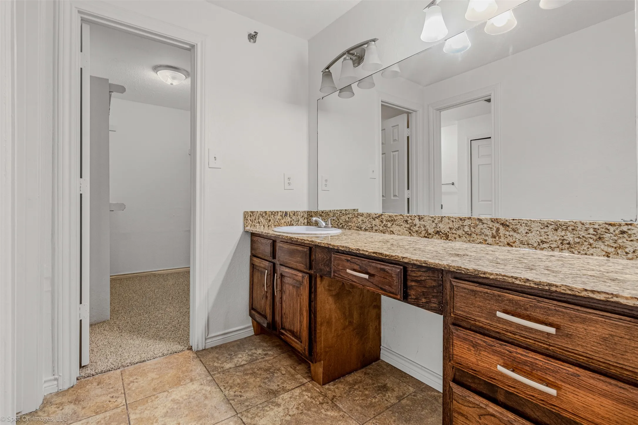 Bathroom with baseboards and vanity