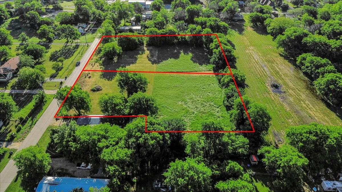 Aerial overview of property's location featuring property parcel outlined