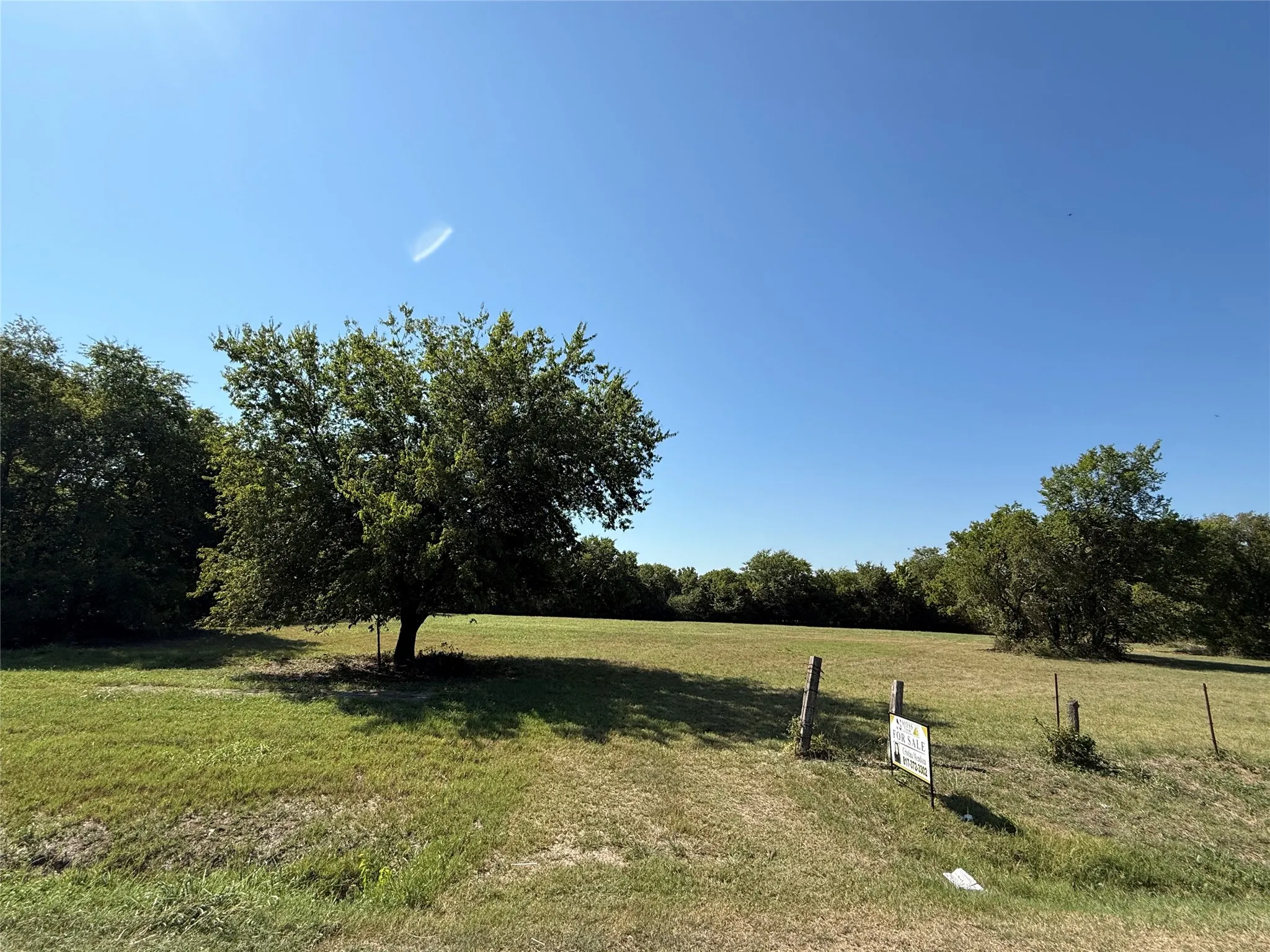 View of green lawn featuring a view of rural / pastoral area