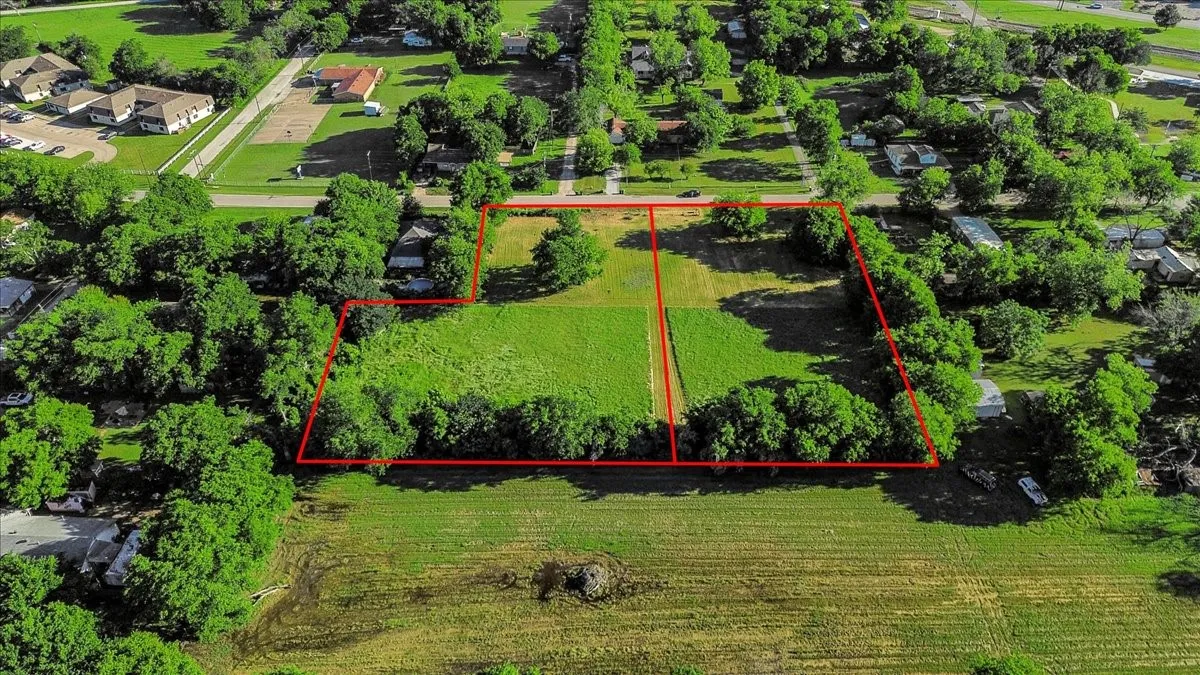 Aerial overview of property's location with property parcel outlined