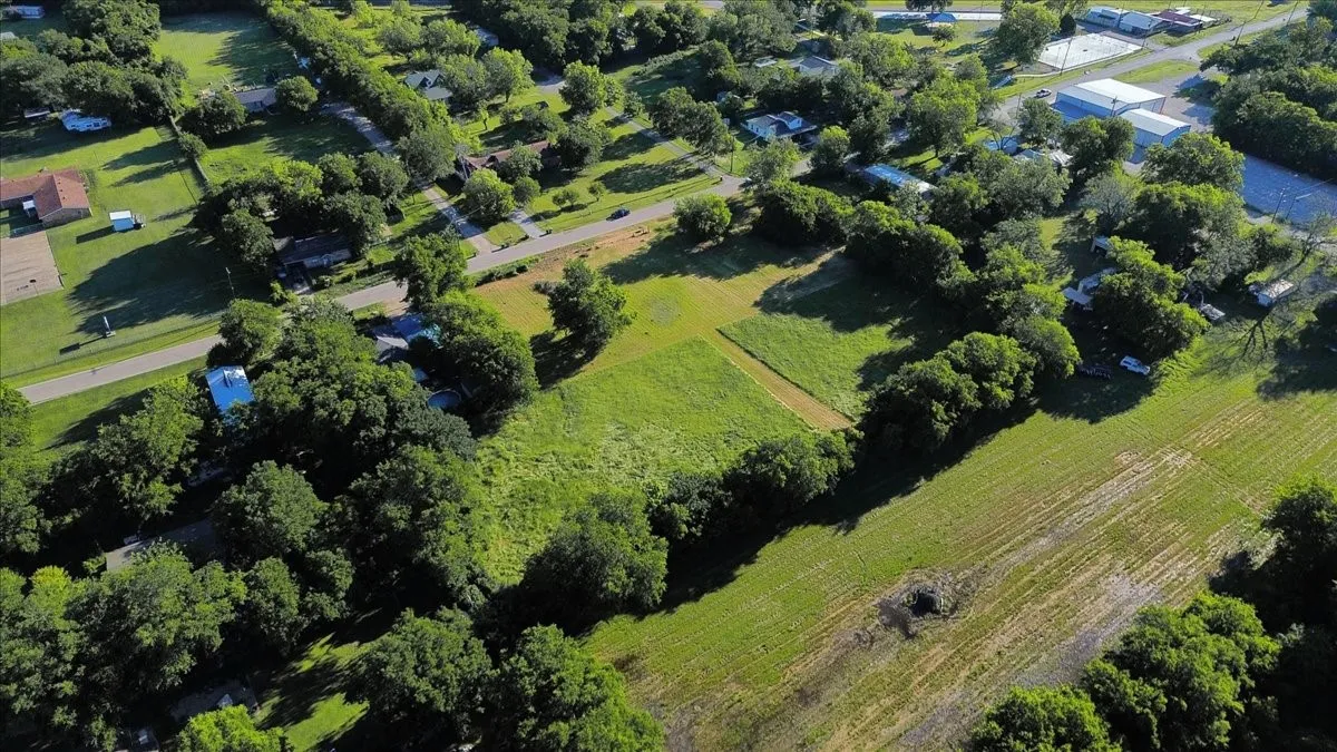 Aerial view of property and surrounding area featuring rural landscape