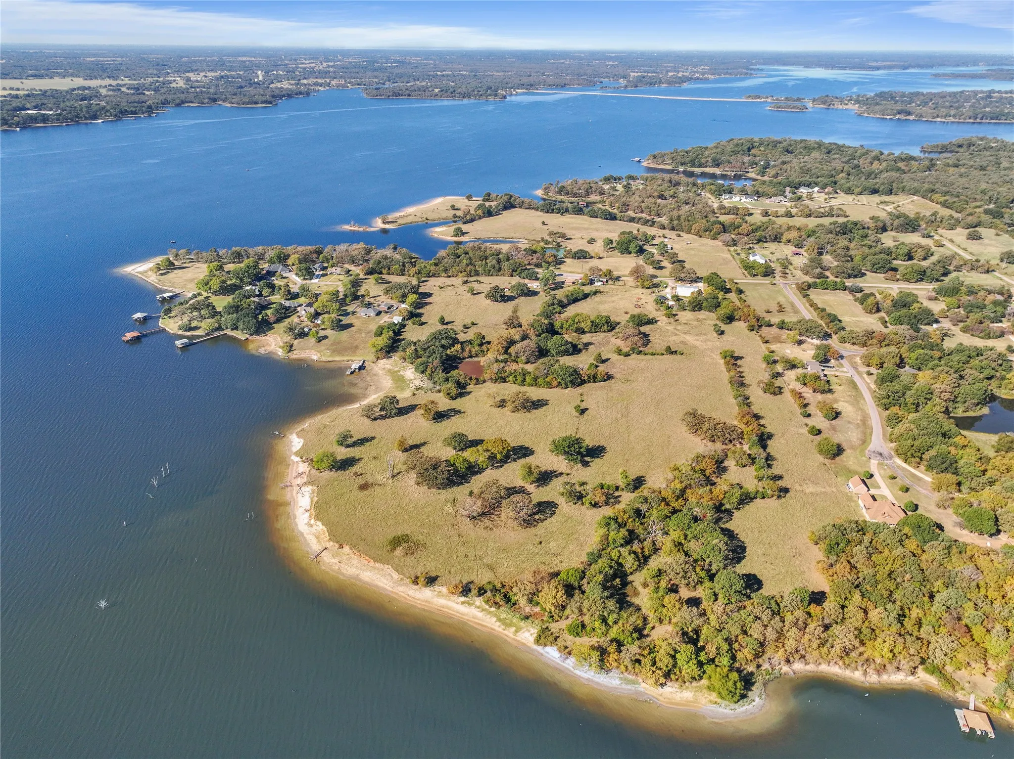 Aerial overview of property's location featuring a nearby body of water