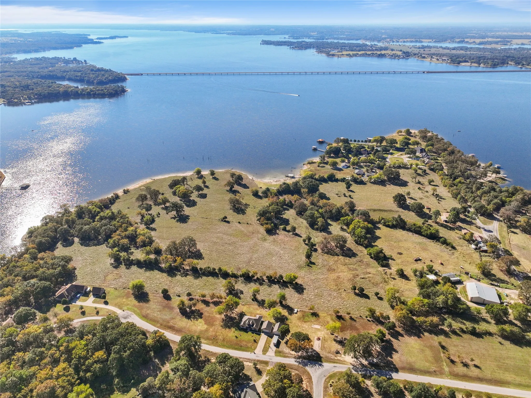 Aerial view of property and surrounding area featuring a large body of water