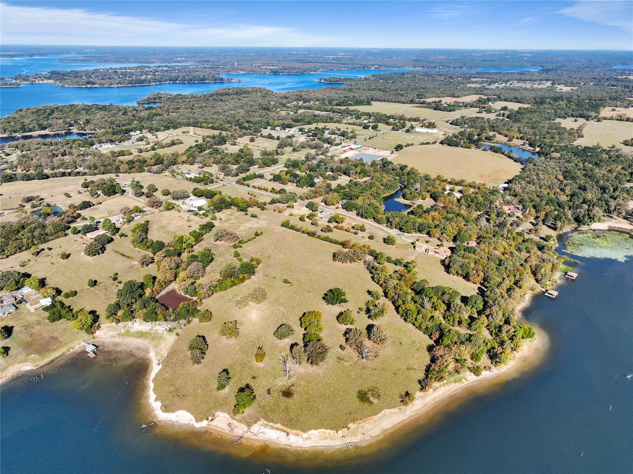 Aerial overview of property's location with a nearby body of water