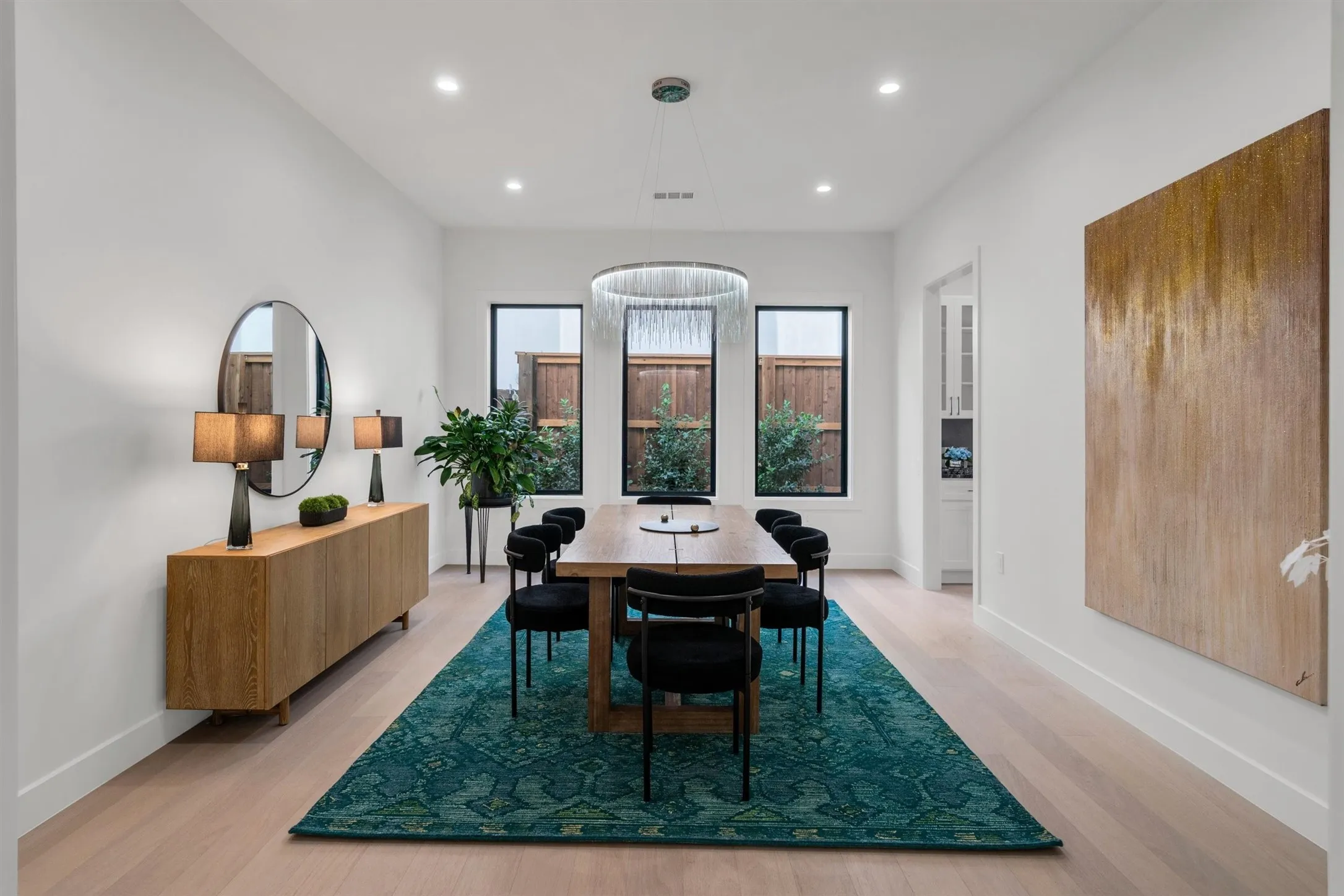 Dining space with recessed lighting, light wood finished floors, and baseboards